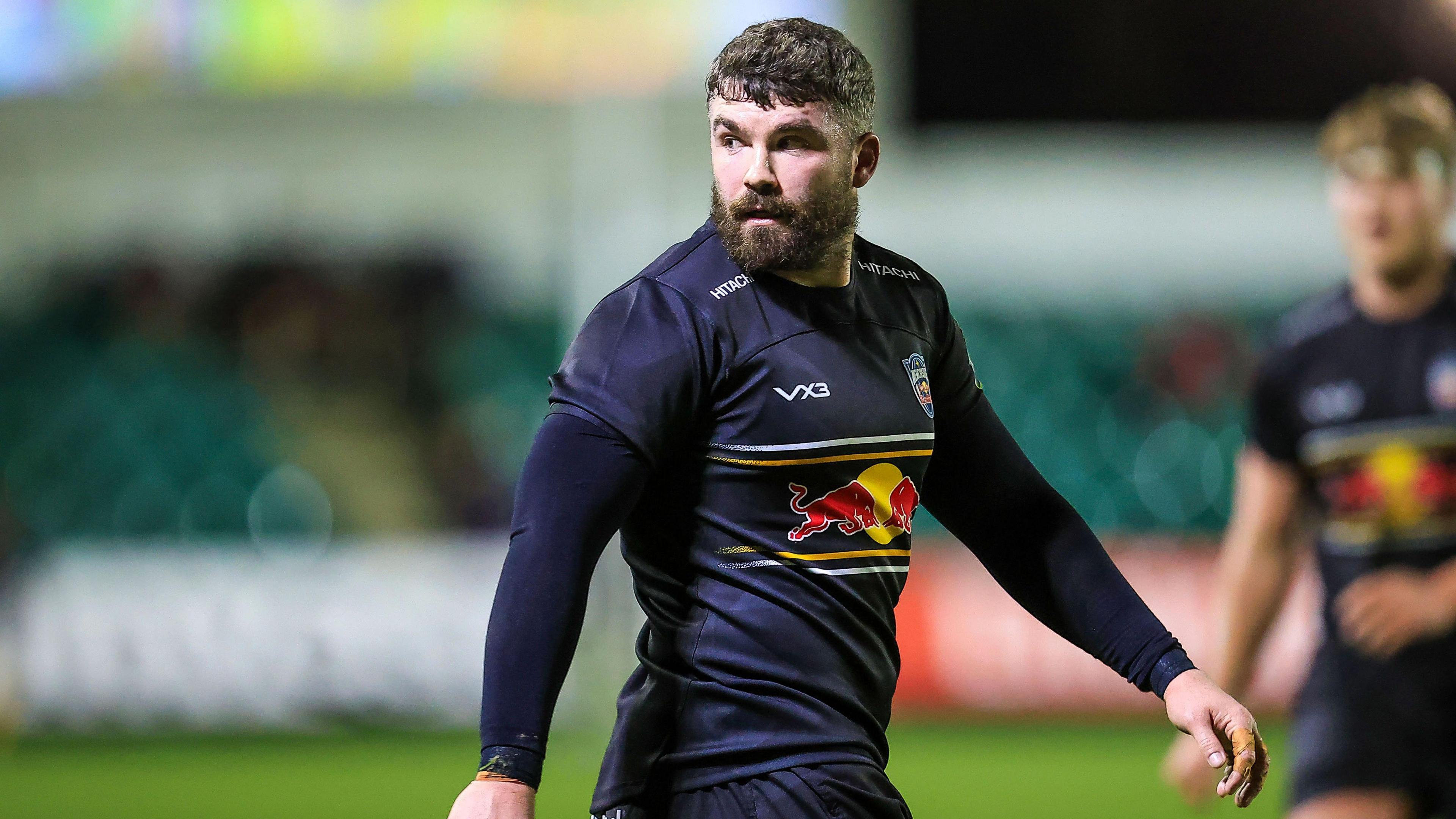 Newcastle Red Bulls' Sammy Arnold walks, looking back over his right shoulder in dark blue kit