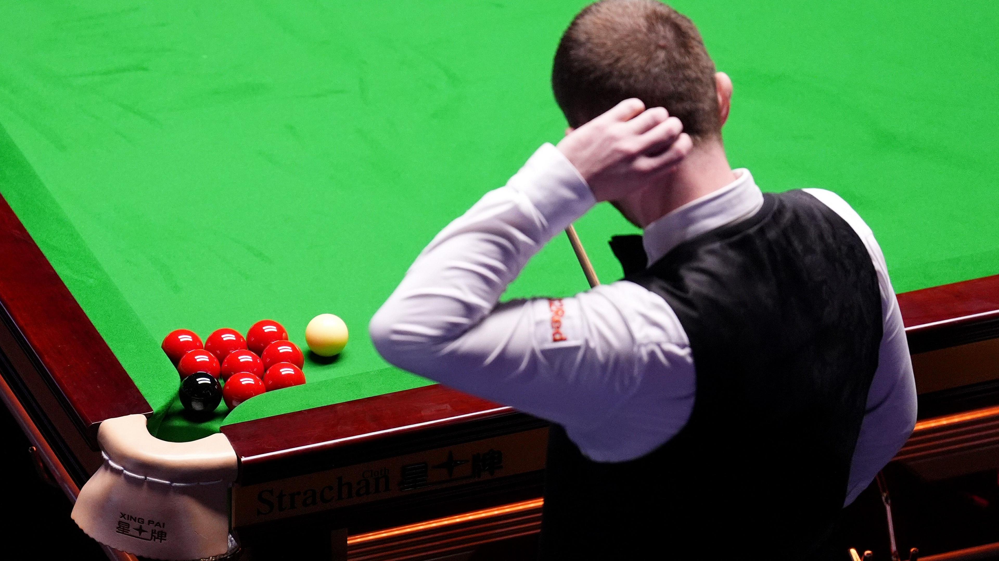 Mark Allen scratches his head