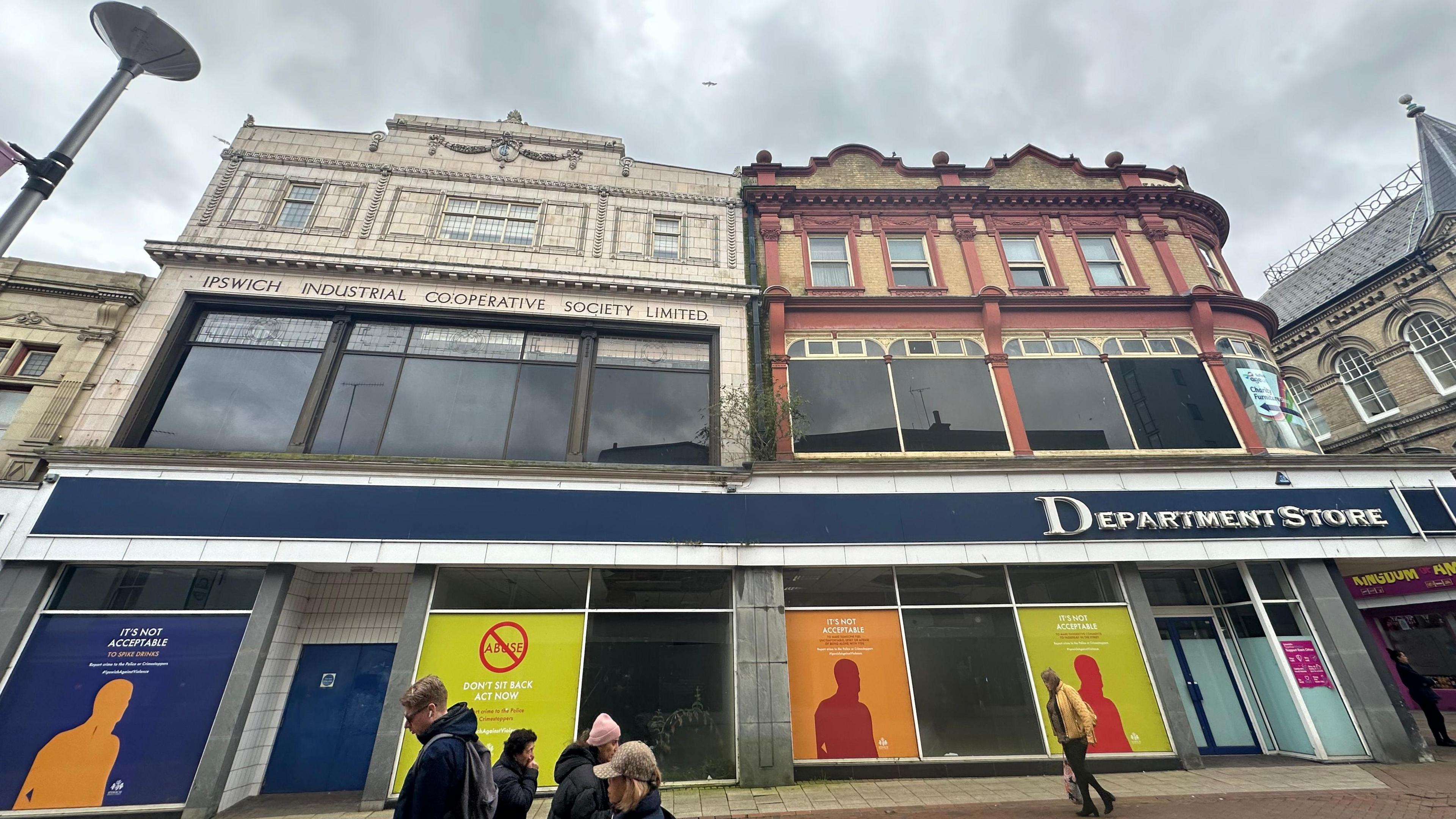 People walking past the former Co-op building in Ipswich town centre