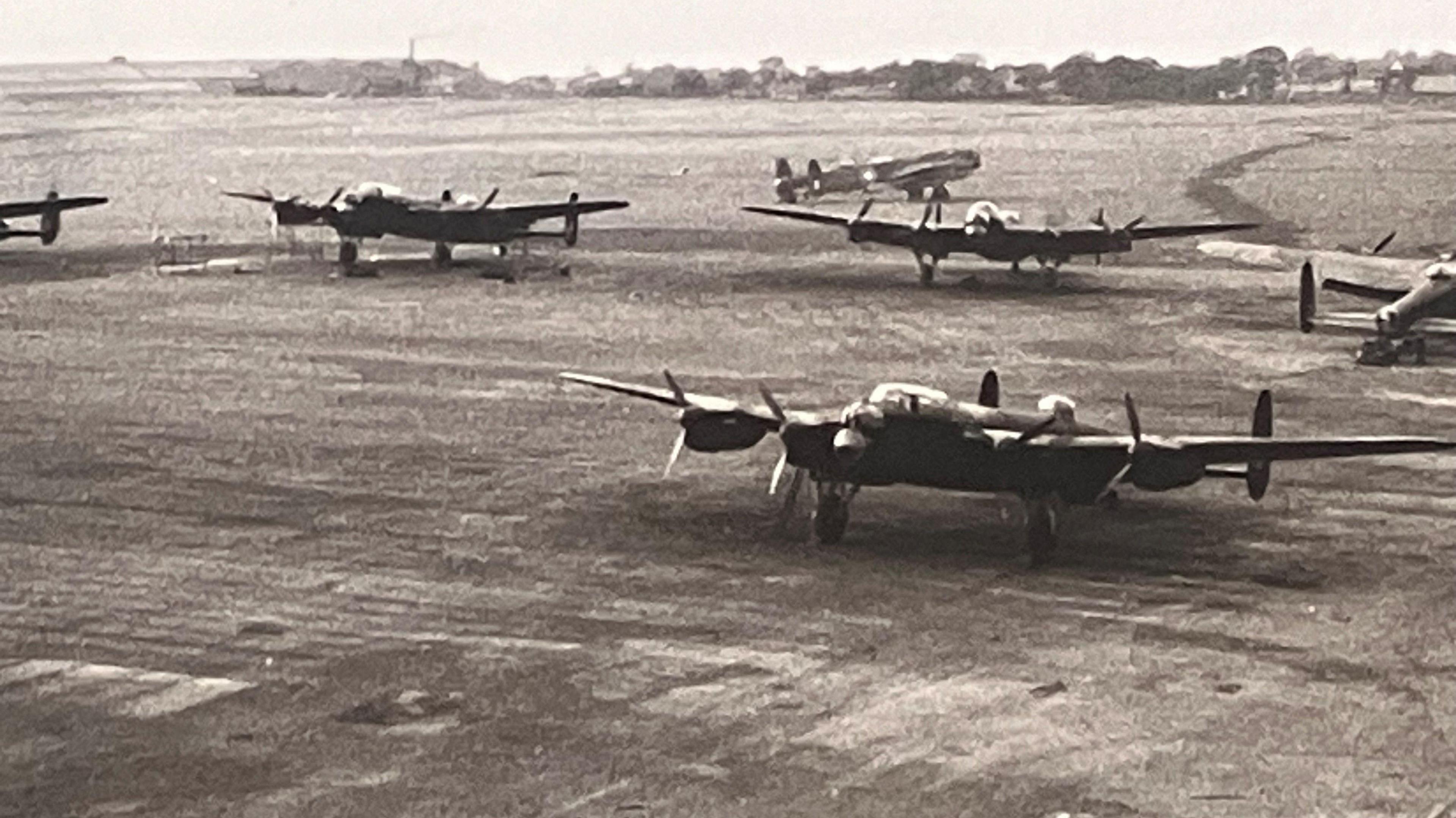 Photo of Woodford Aerodrome in WW2 with Lancaster Bombers on the air field 