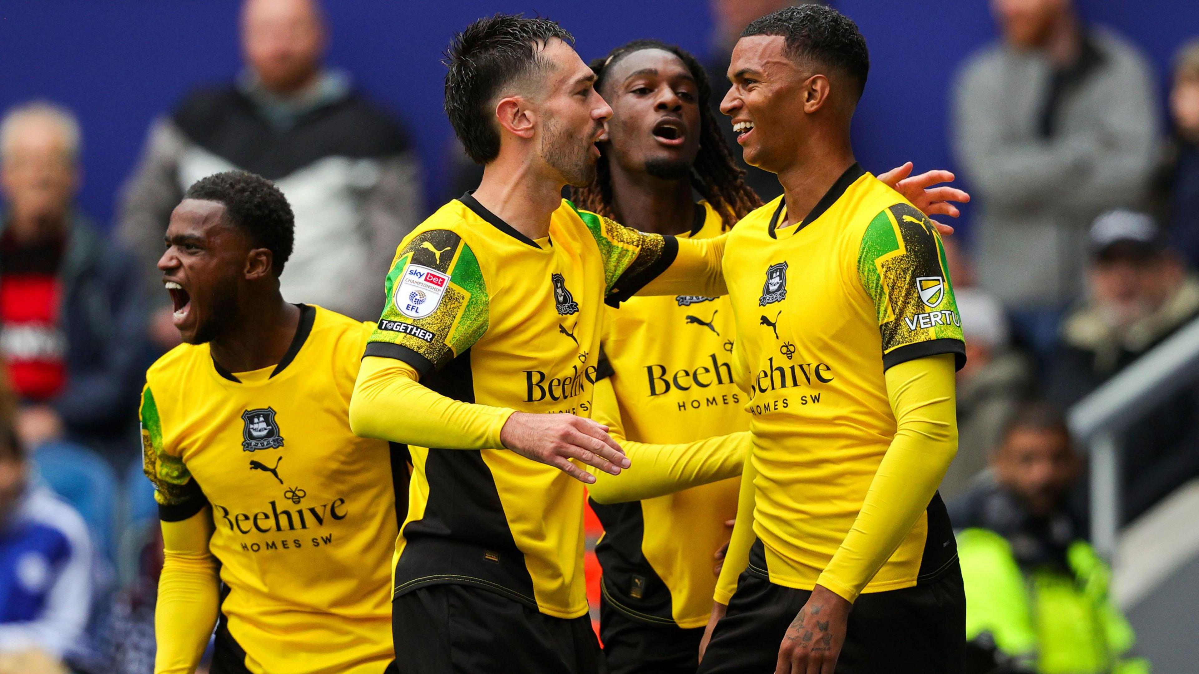 Plymouth Argyle players celebrate Morgan Whittaker's equaliser against QPR