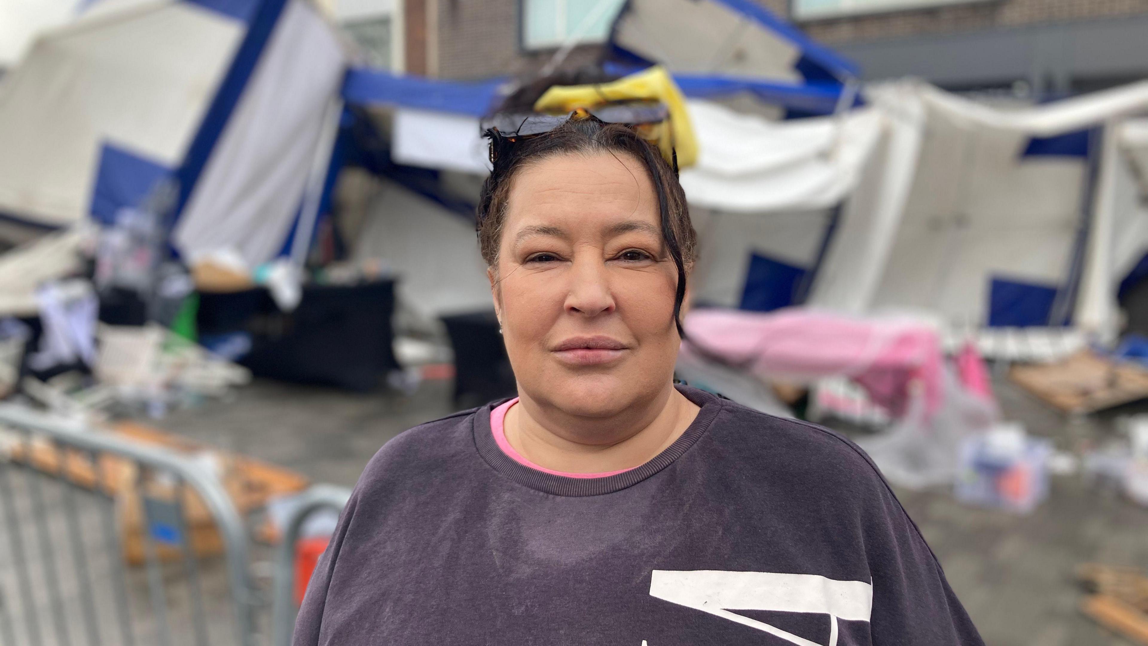 Helen Wolstencroft of ‘Lillie’s’ hand craft stall stands in front of her gazebo, which was flattened in the storm.