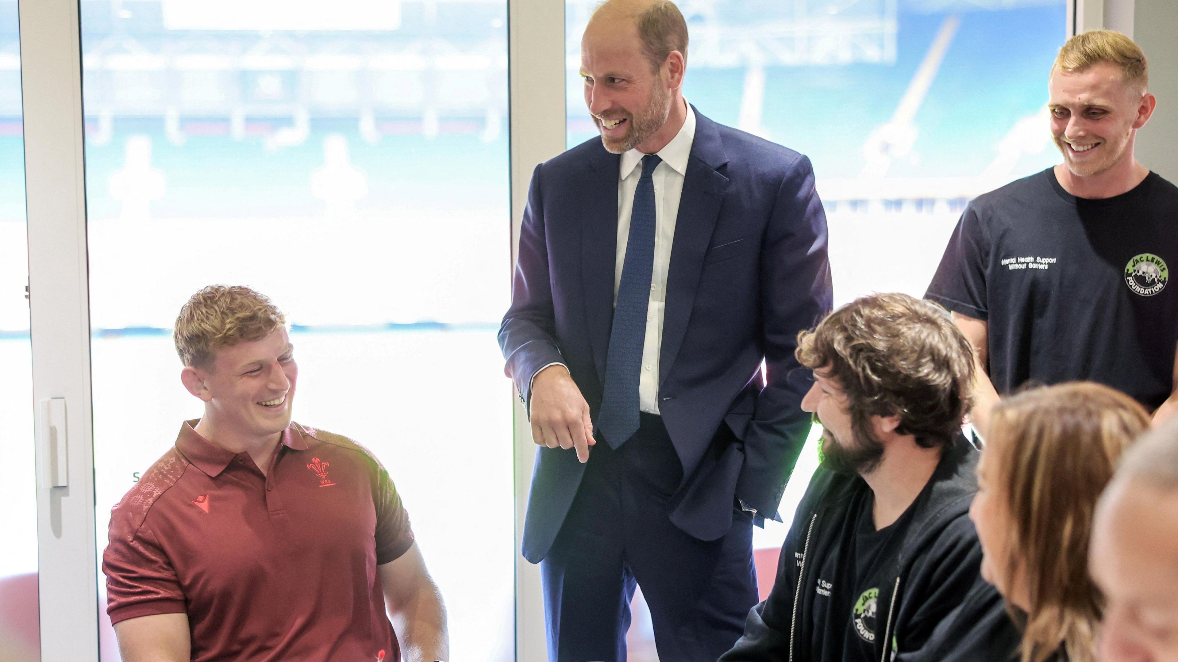 Prince William in a suit and tie at the Jac Lewis Foundation in Cardiff