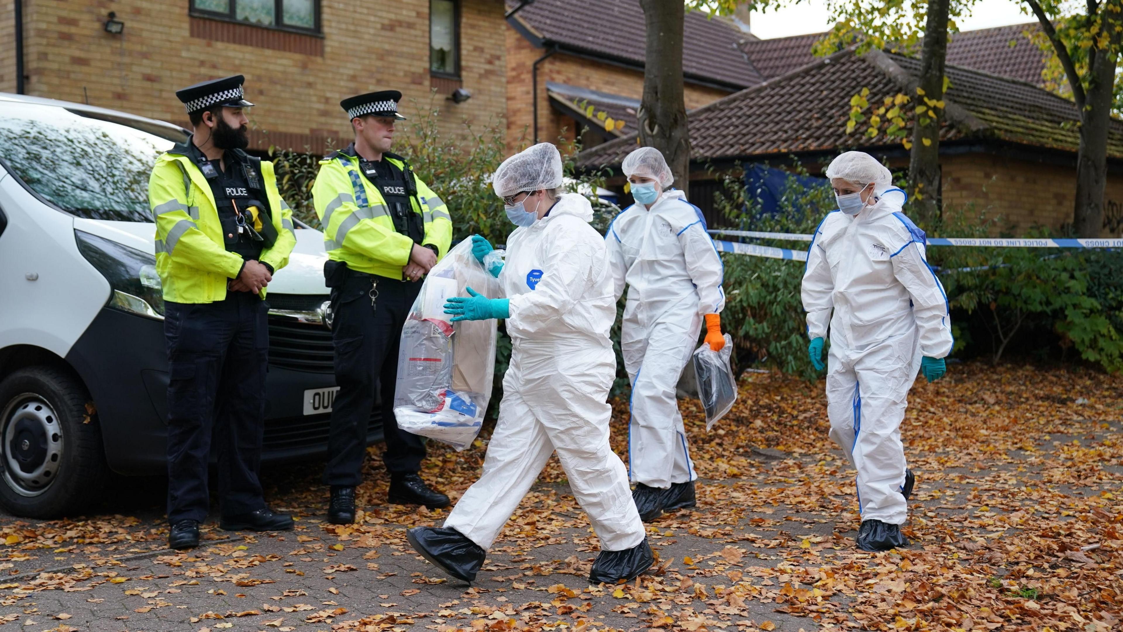 Police leaving the property where Leach Croucher's body was found