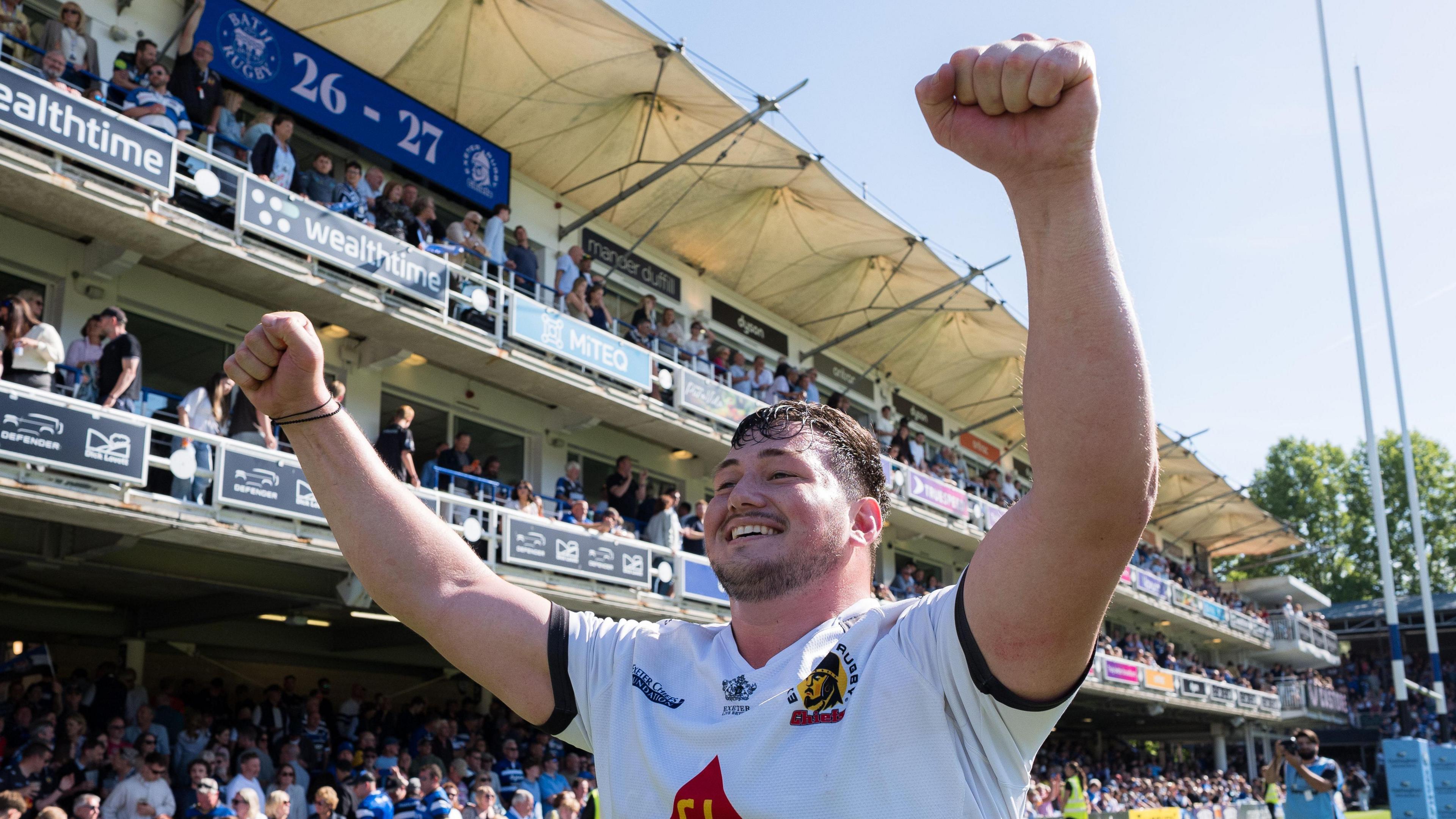 Bachuki Tchumbadze celebrating with his arms aloft while playing for Exeter Chiefs.