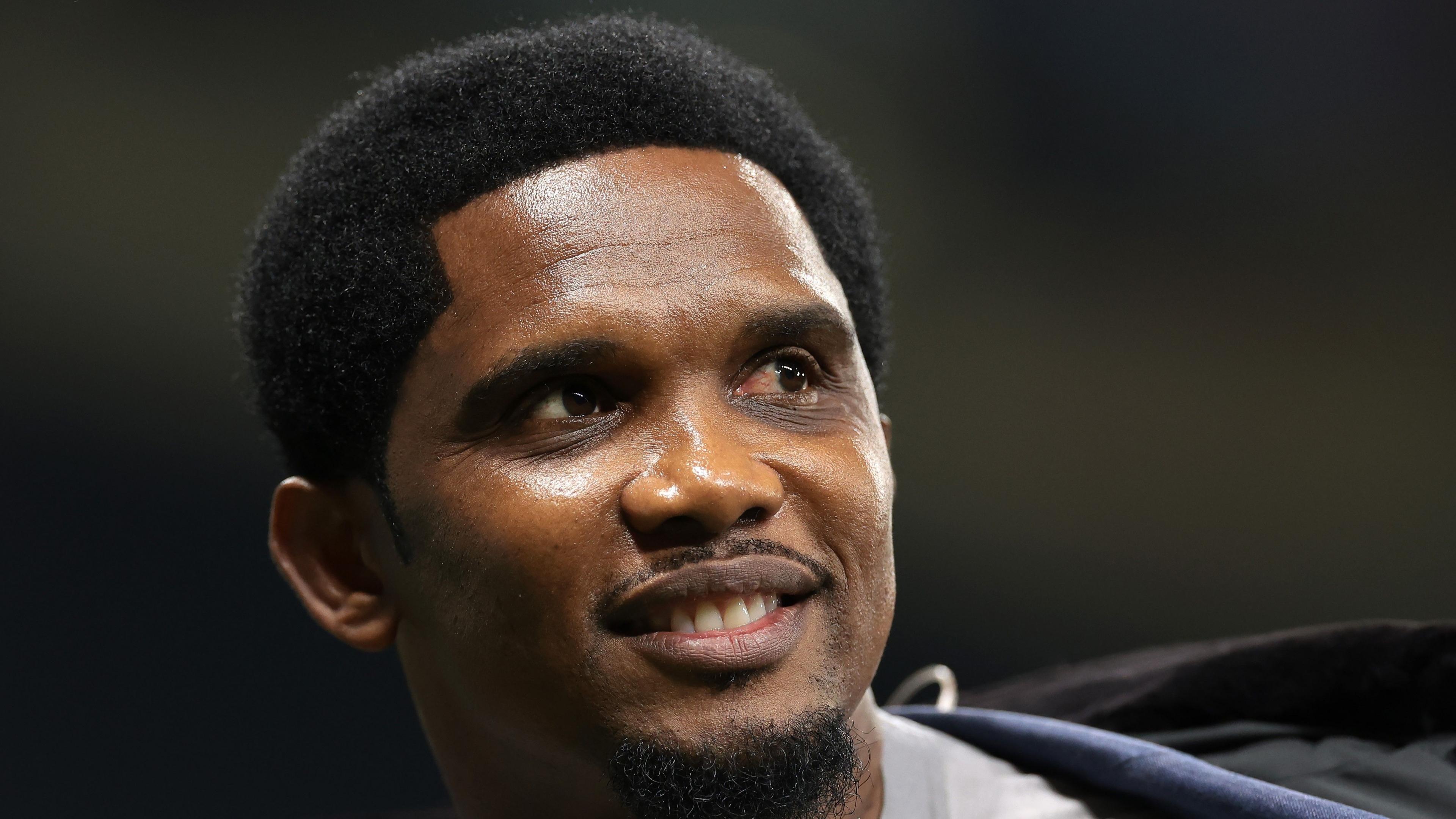 A headshot of Samuel Eto'o looking to his left and smiling.