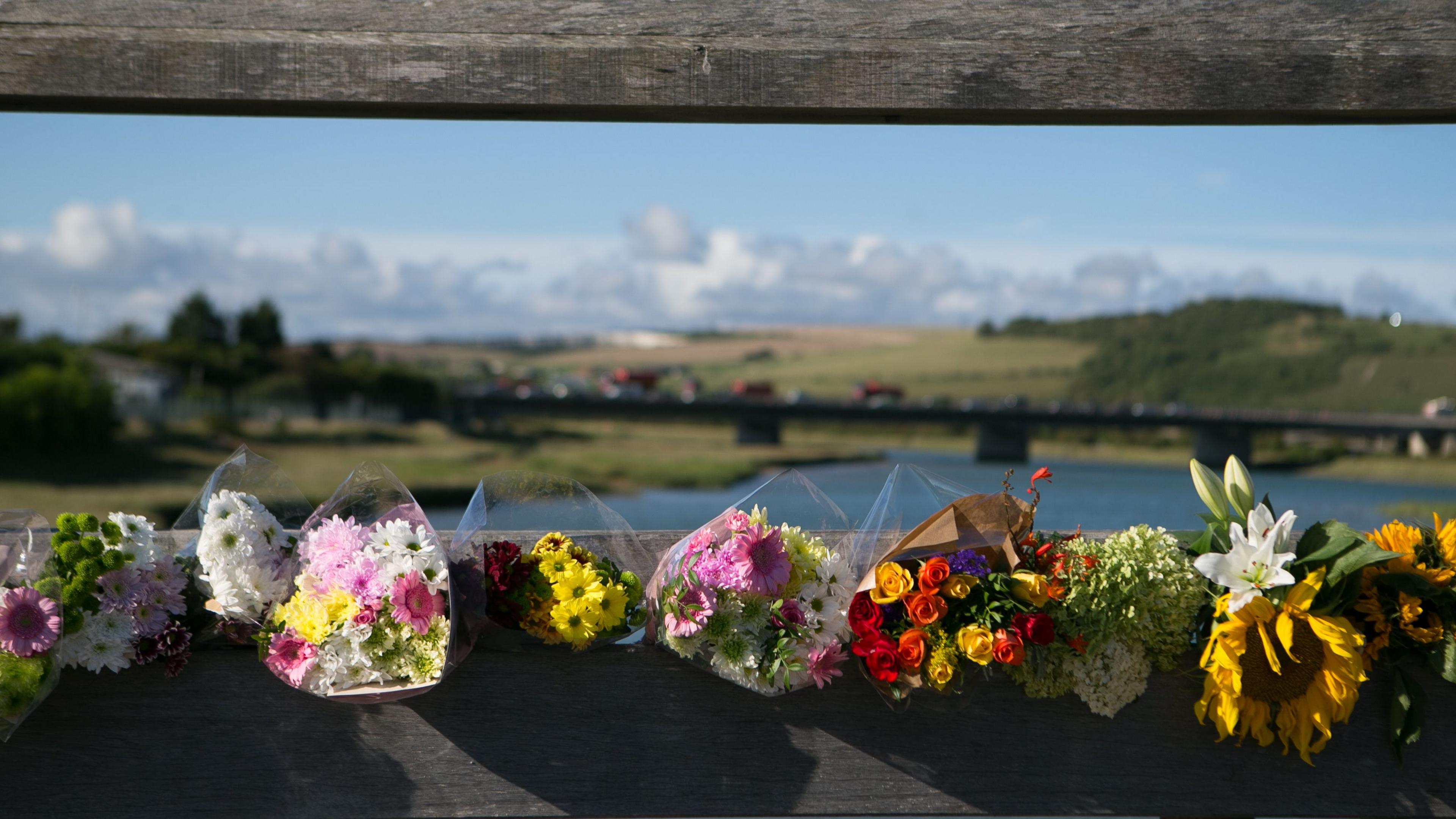 Flowers in tribute to Shoreham air crash victims on a toll bridge close to the crash scene