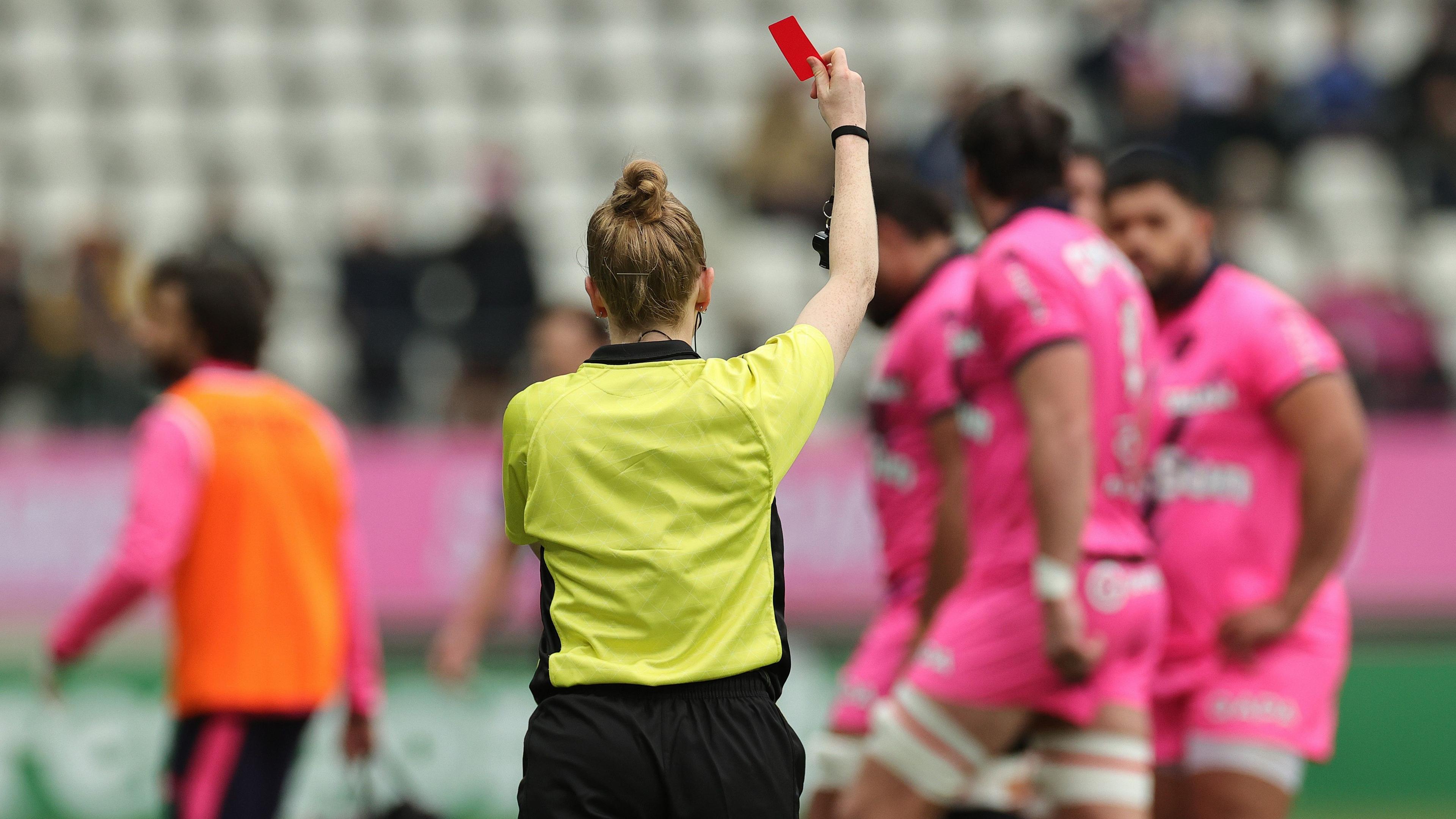 Referee Hollie Davidson shows a red card