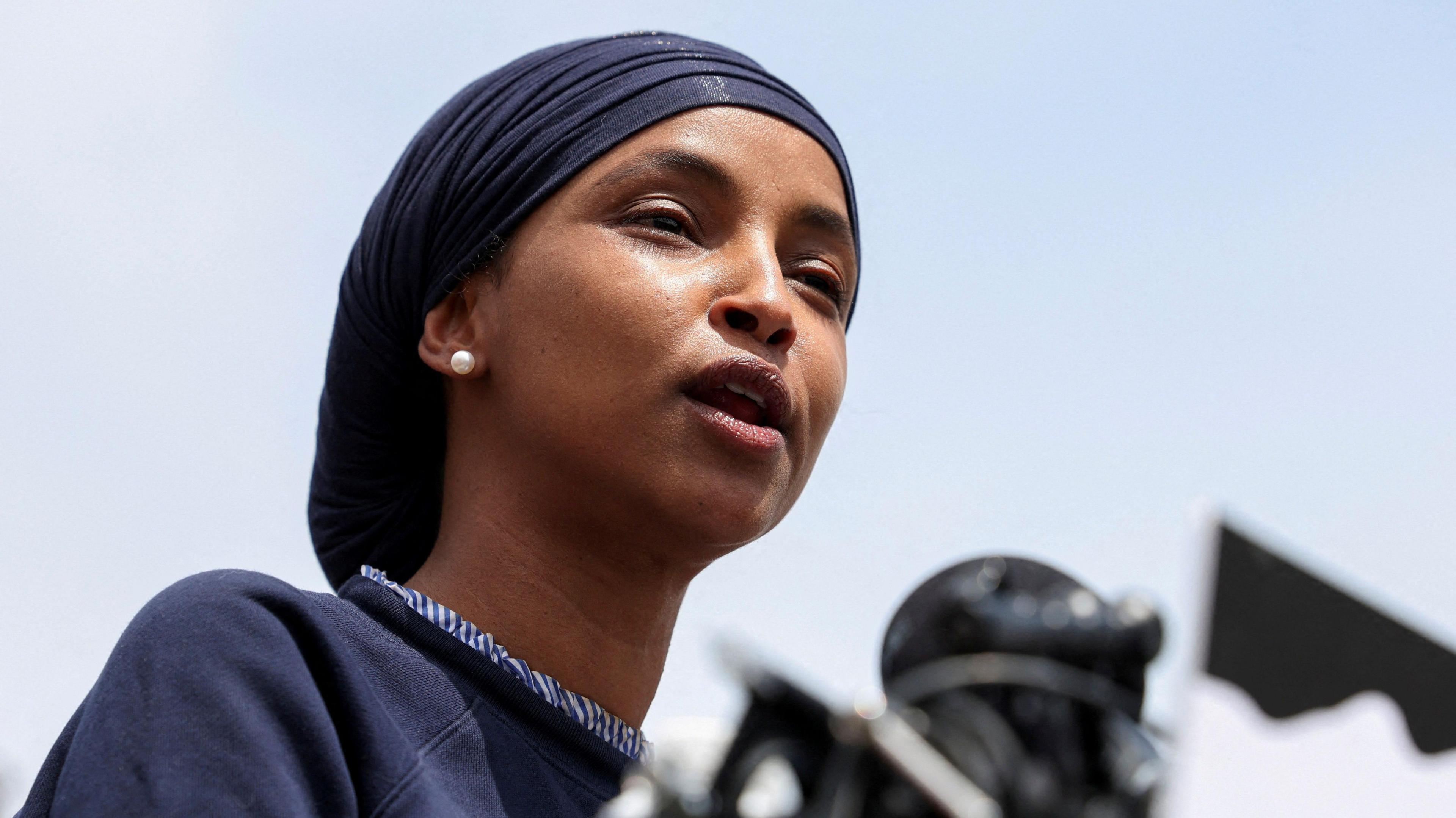 Ilhan Omar pictured from an angle looking up at her face