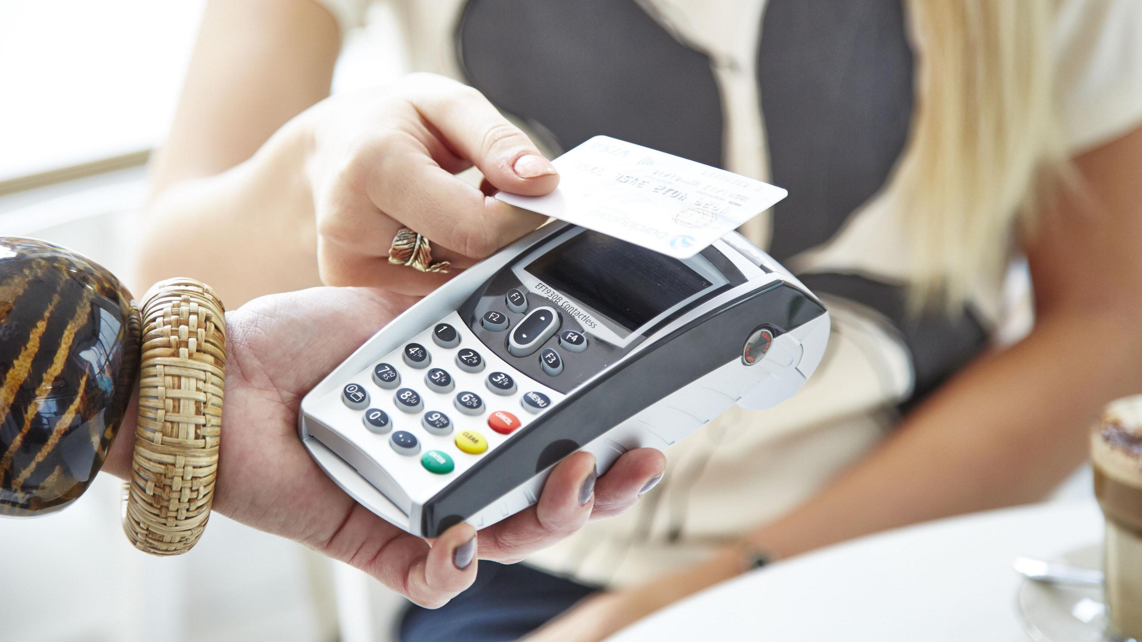 Credit card being used to make a contactless payment