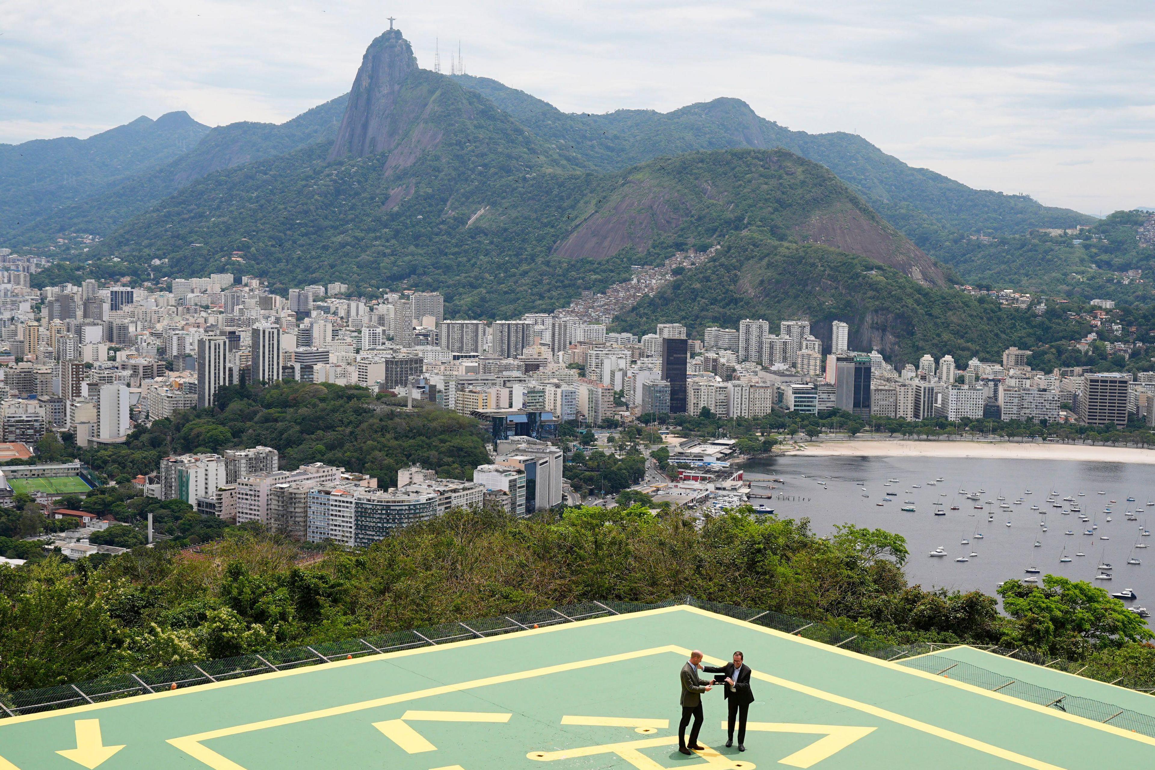 The Prince of Wales (left) is presented with the keys to the city by the Mayor of Rio de Janeiro, Eduardo Pae - with Rio in the background