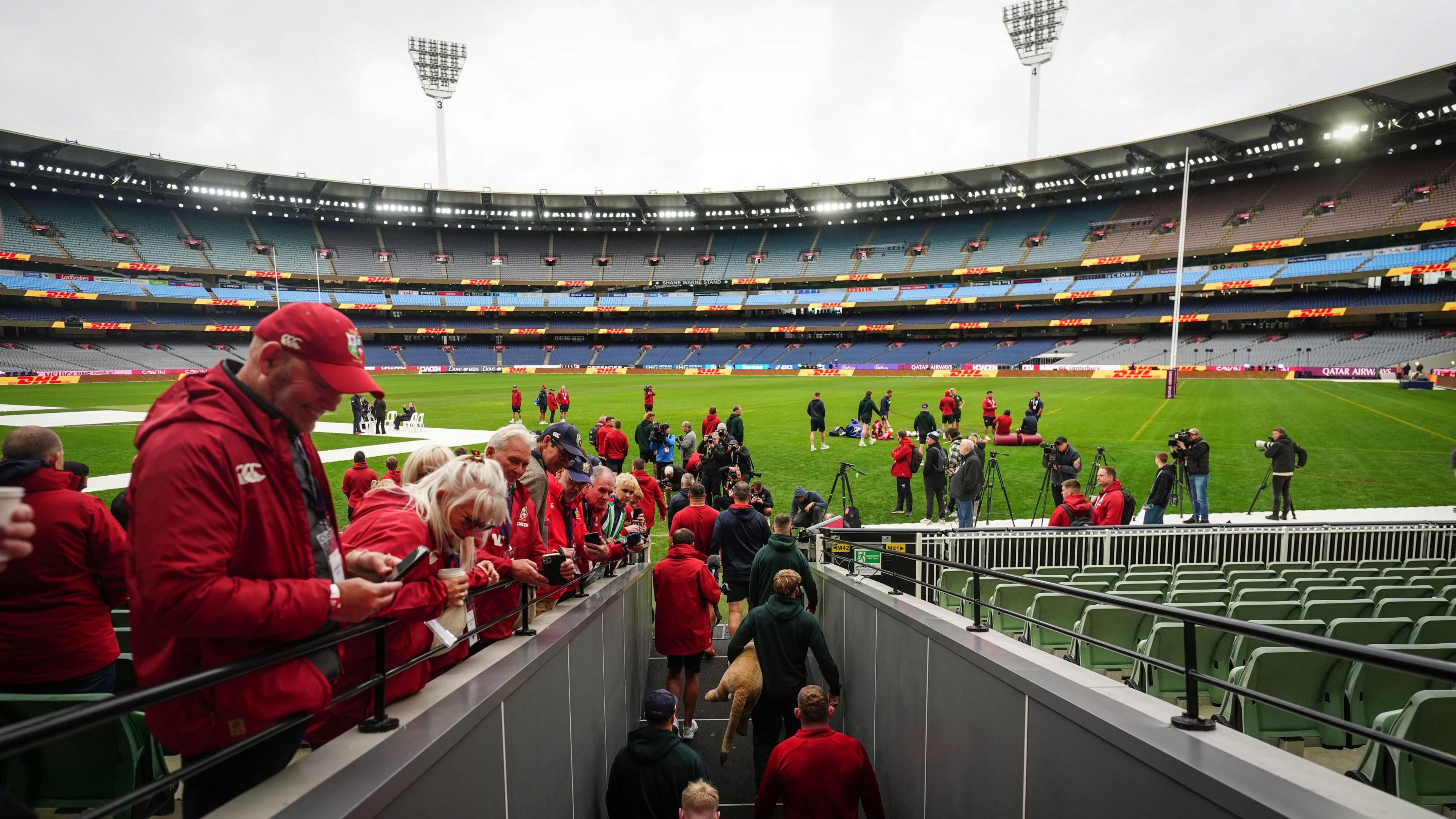 Lions players walk out at the Melbourne Cricket Ground