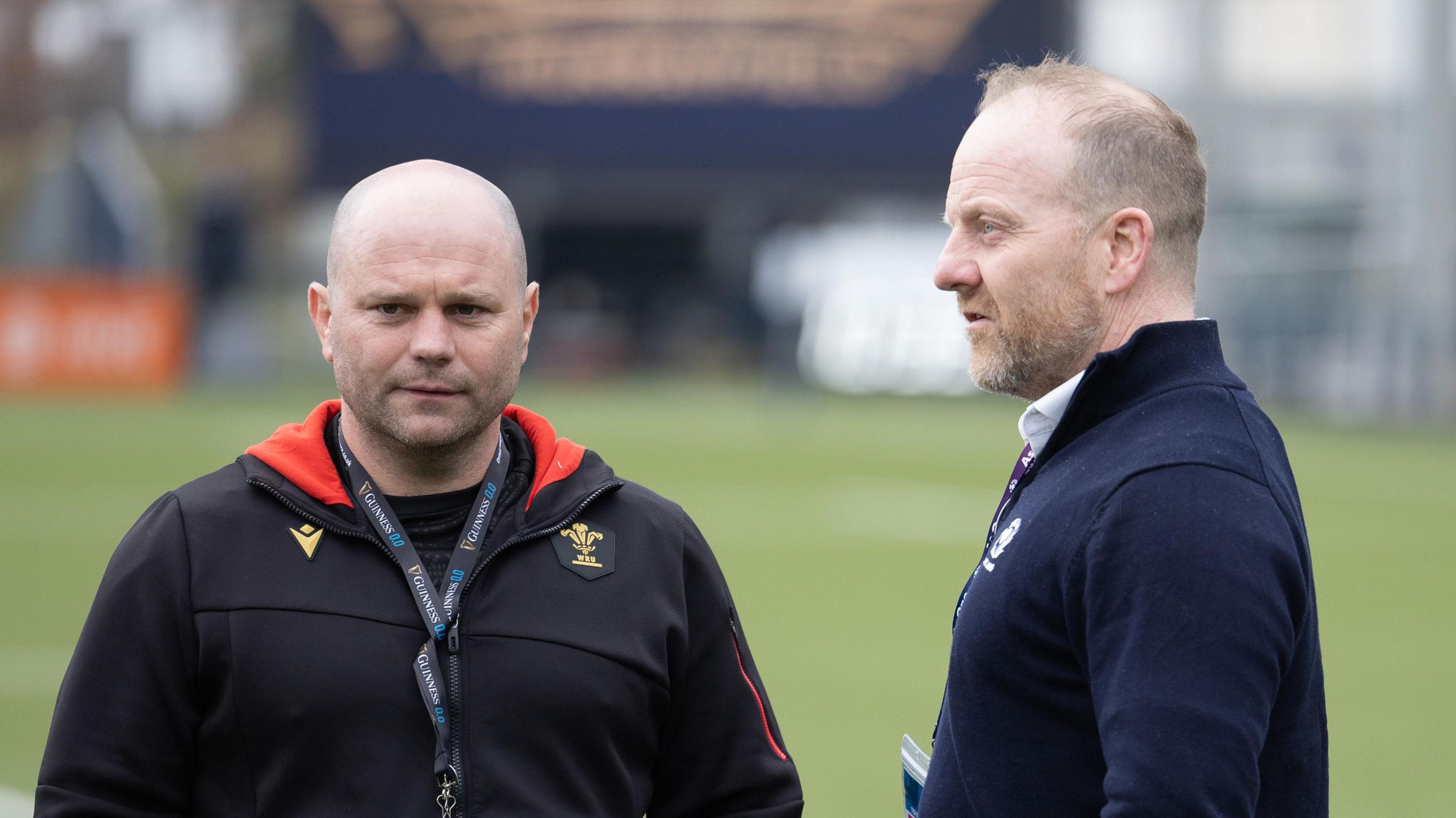 Wales head coach Sean Lynn chats with Scotland head coach Bryan Easson before their 2025 Six Nations meeting