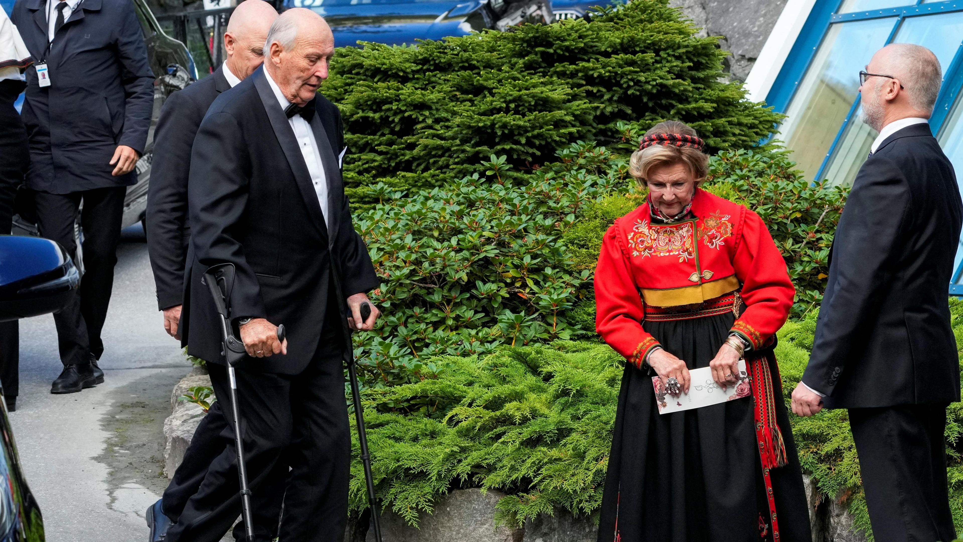 Norway's King Harald and Queen Sonja walk outside Hotel Union