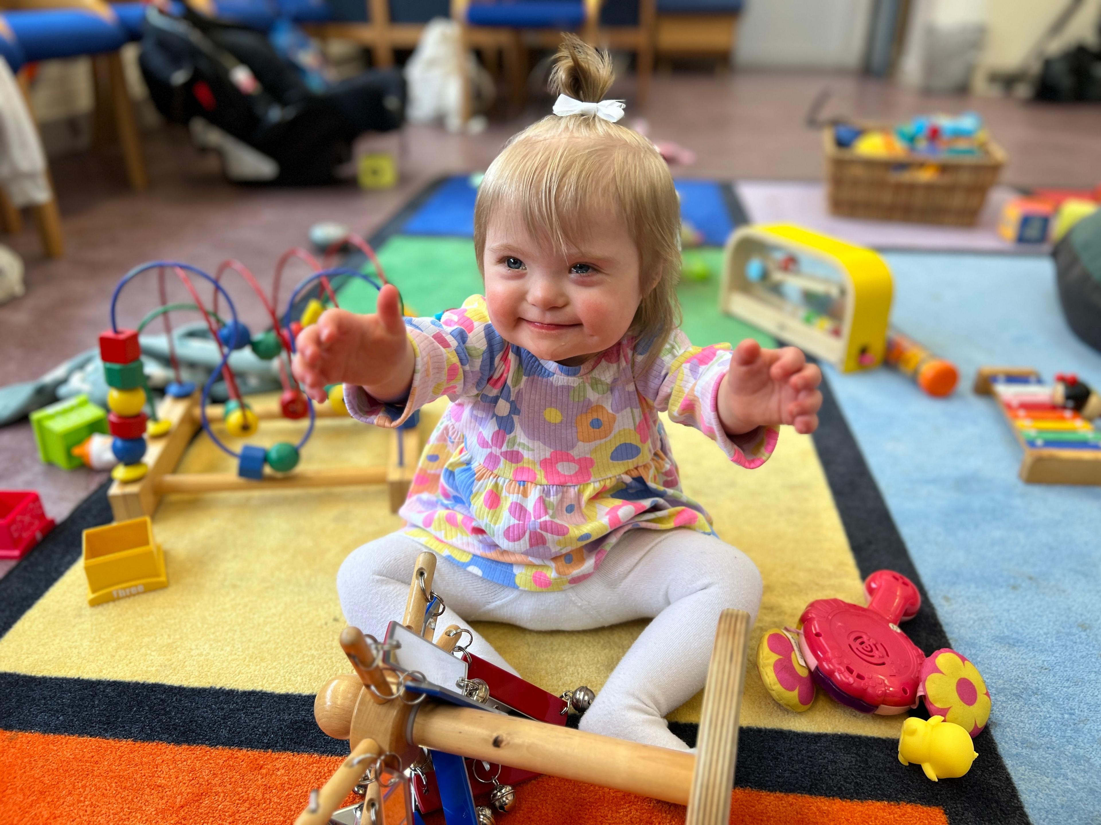 Verity playing with toys