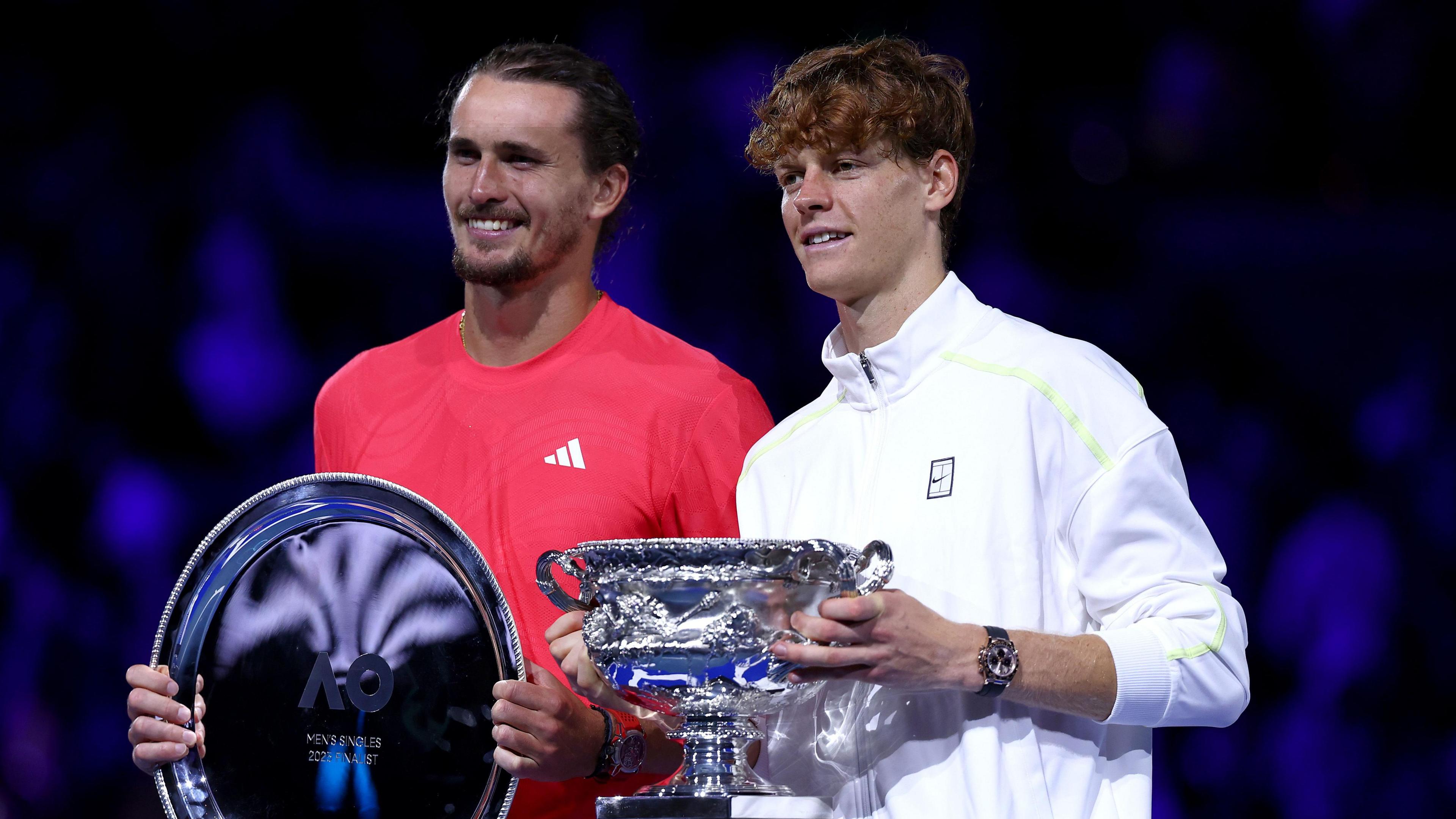 Alexander Zverev and Jannik Sinner pose with their trophies after the 2025 Australian Open final