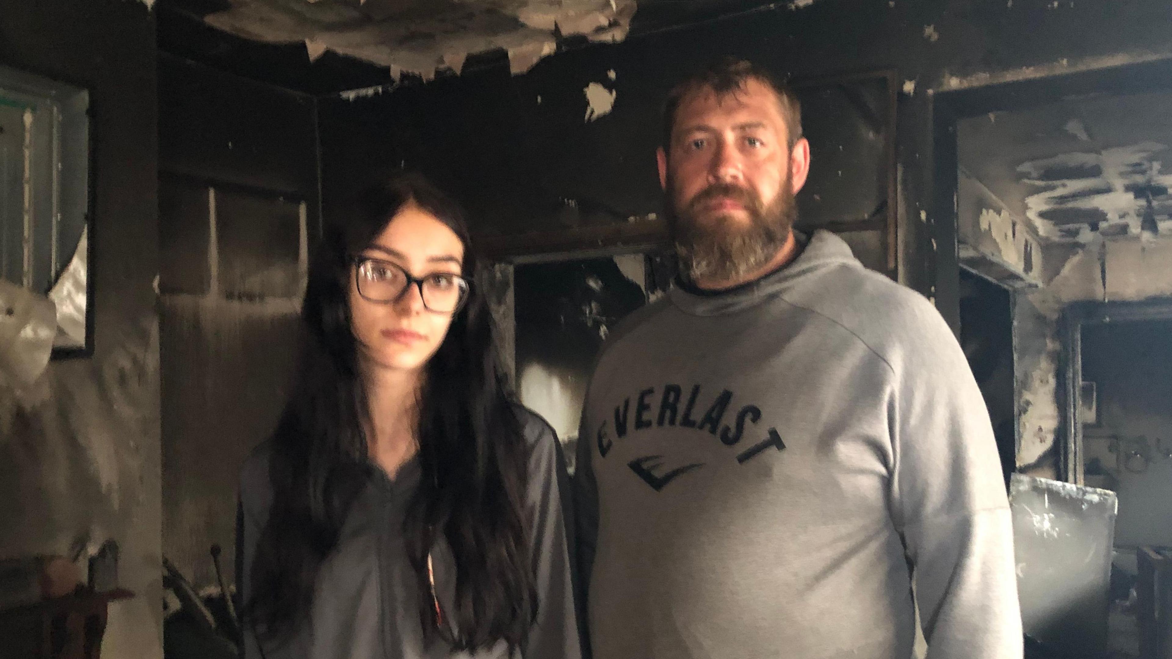 Katelyn and Simon Blanshard in the charred property