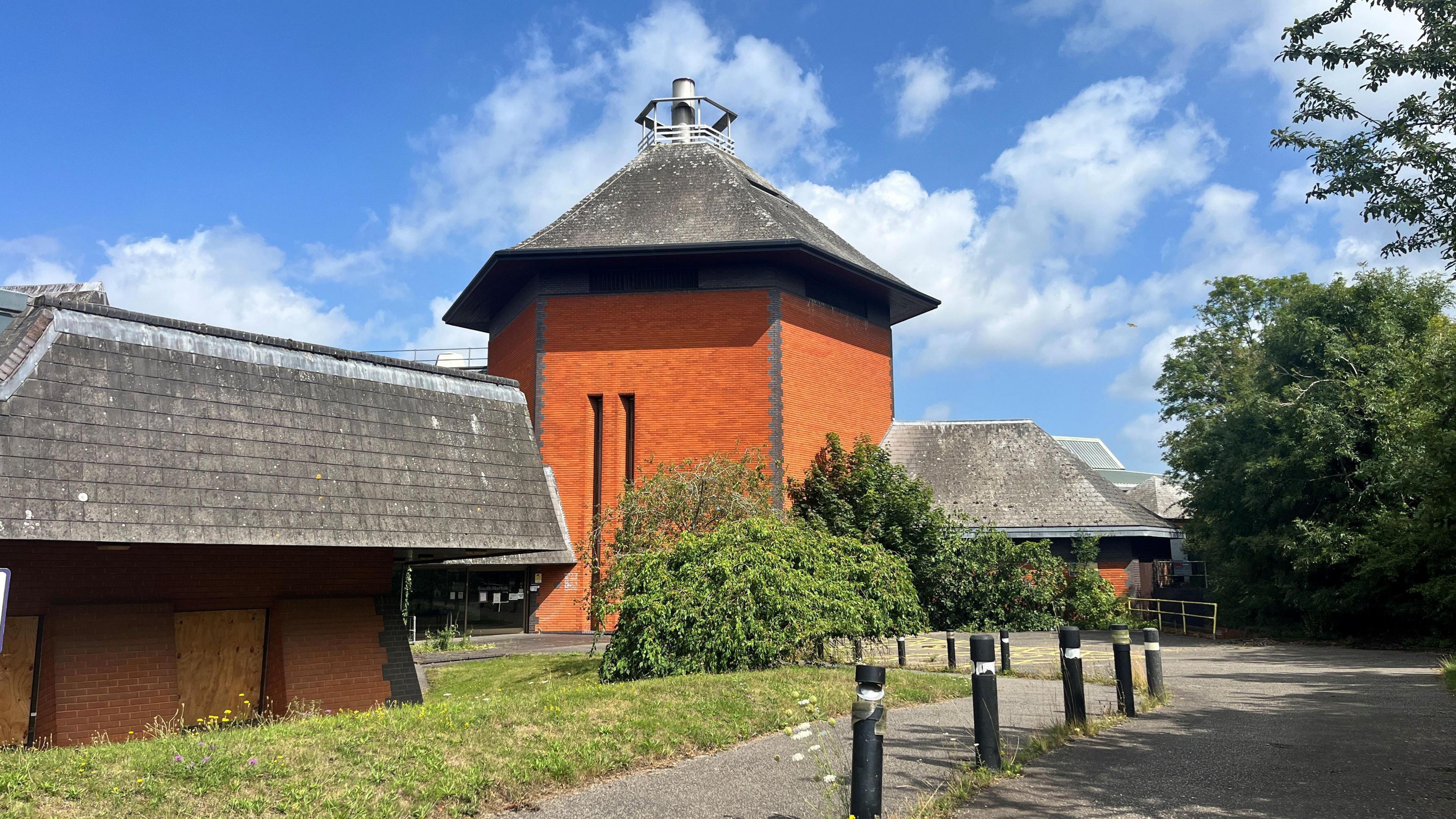 We can see part of South Norfolk House - a large, central tower type structure, made out of red bricks.