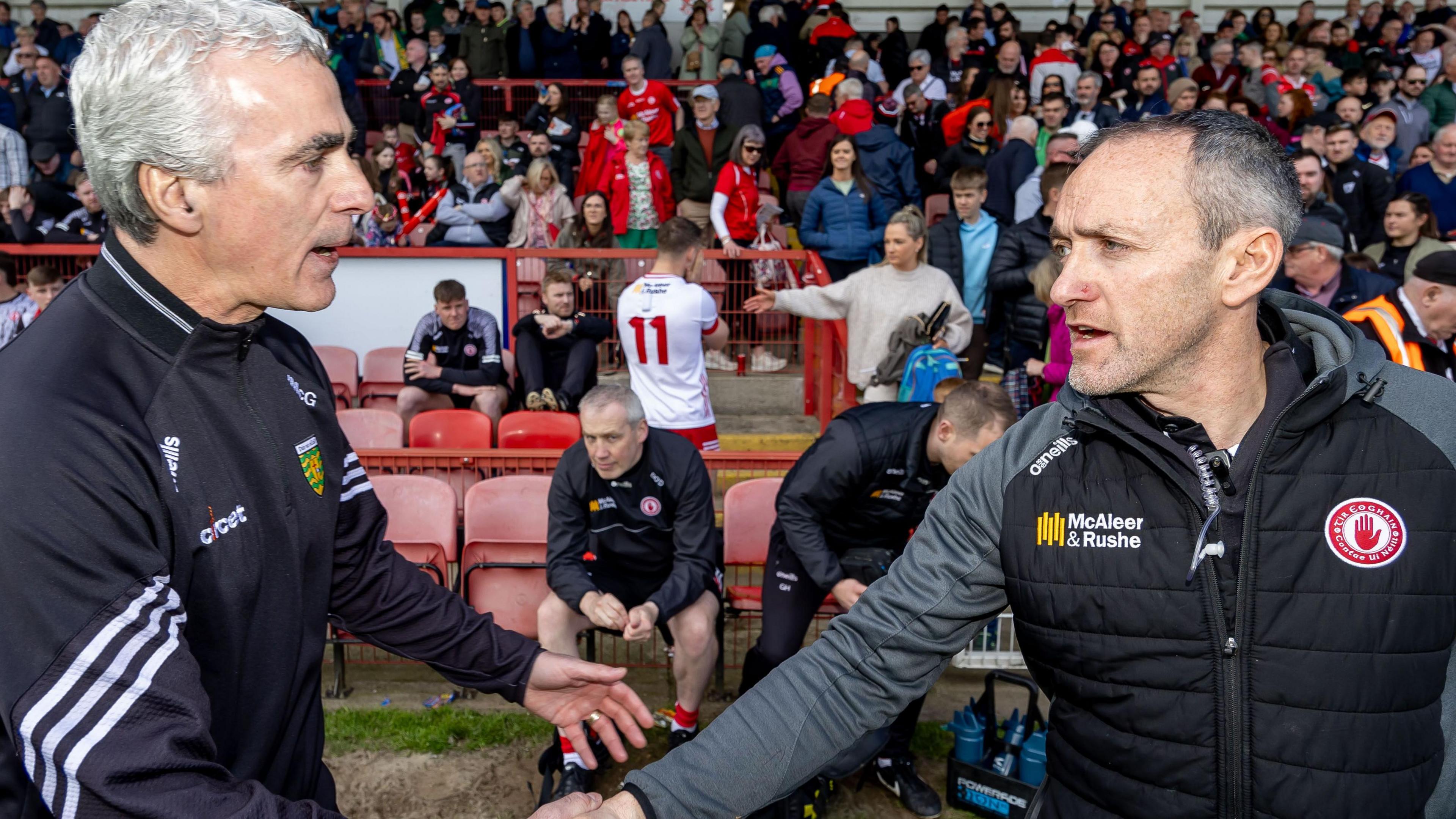 Brian Dooher shakes hands with Jim McGuinness