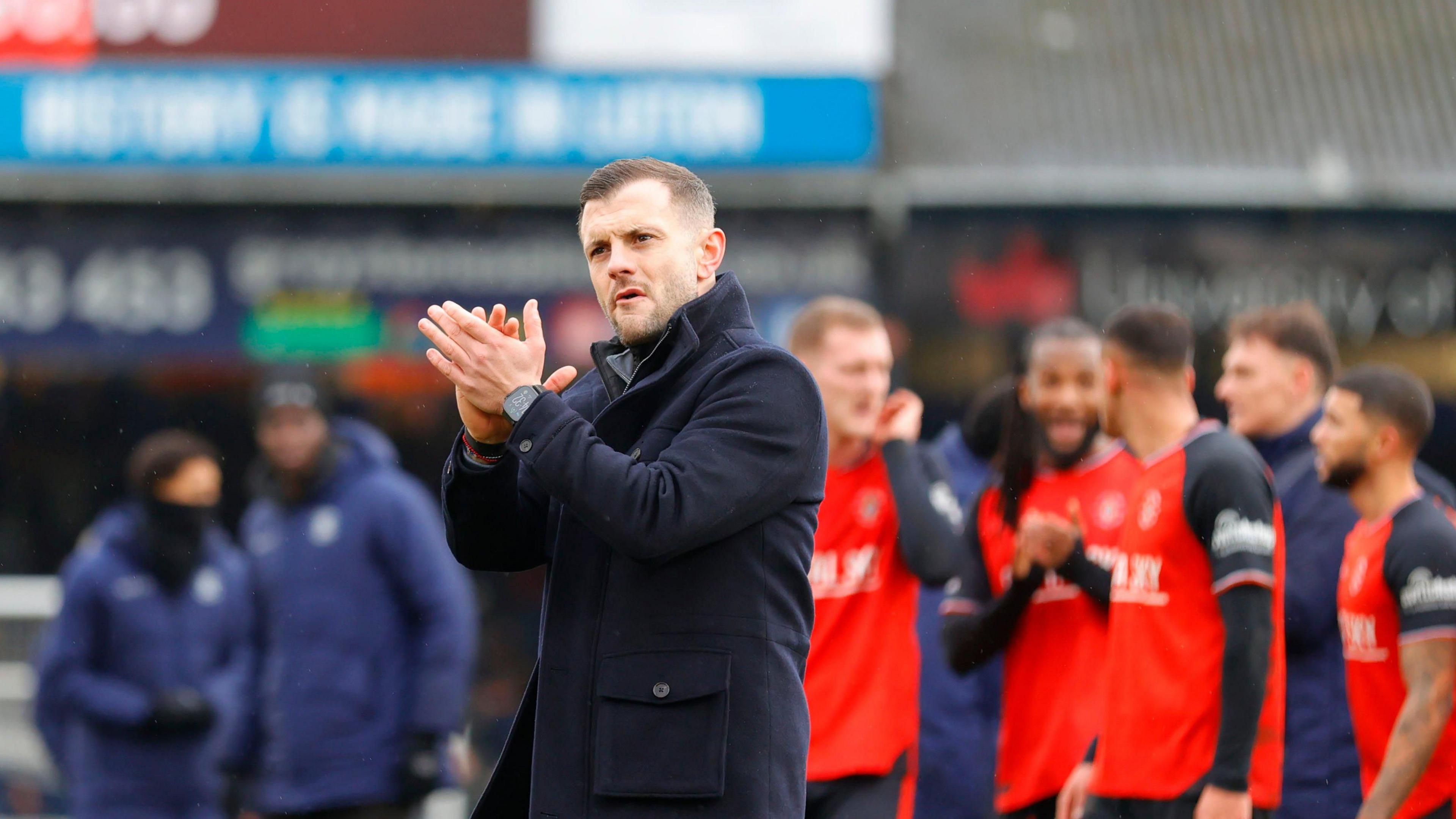 Manager Jack Wilshere applauds the Luton Town fans after the win over Bradford City