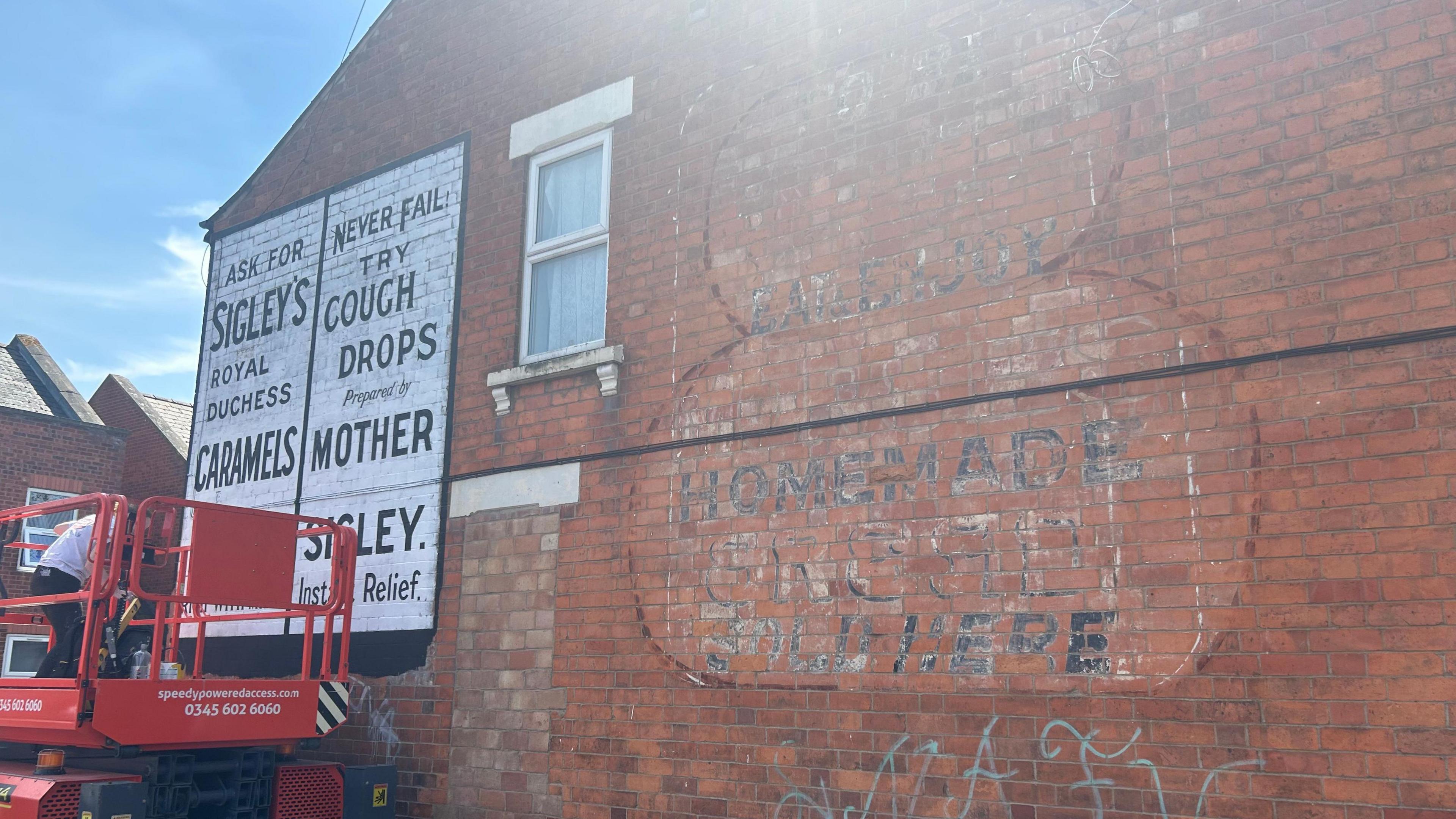 Ghost signs on a brick building