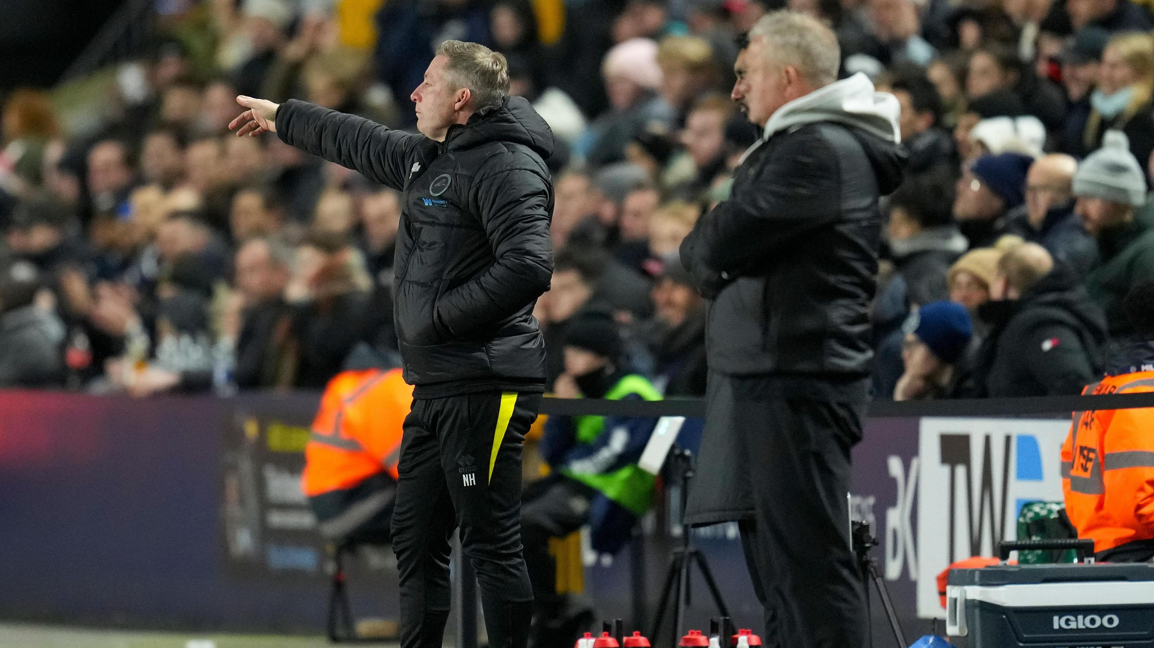 Neil Harris [left] and Chris Wilder on the touchline during Sheffield United's victory against Millwall at The Den