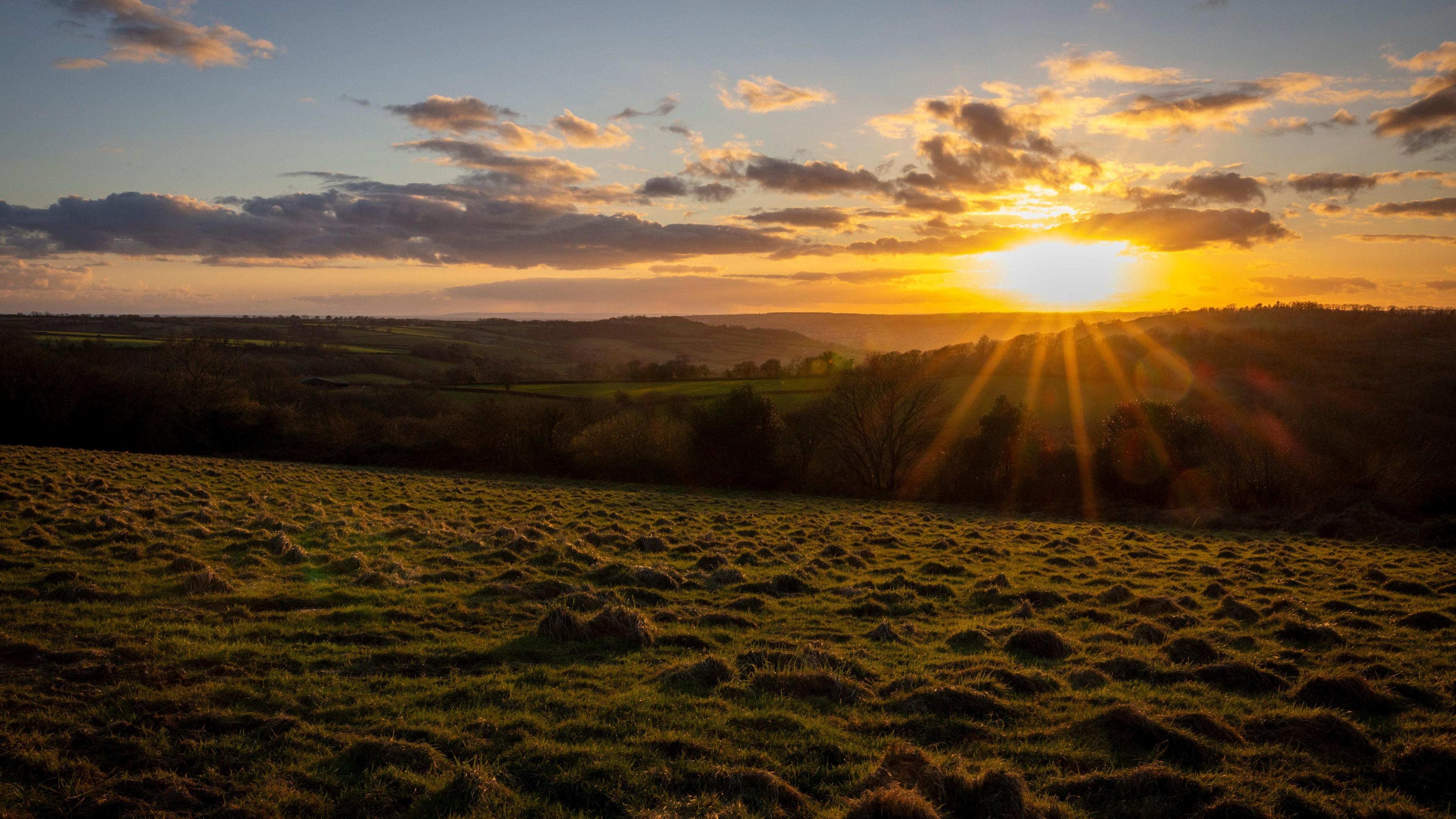 Landscape photo of countryside with the sun rising