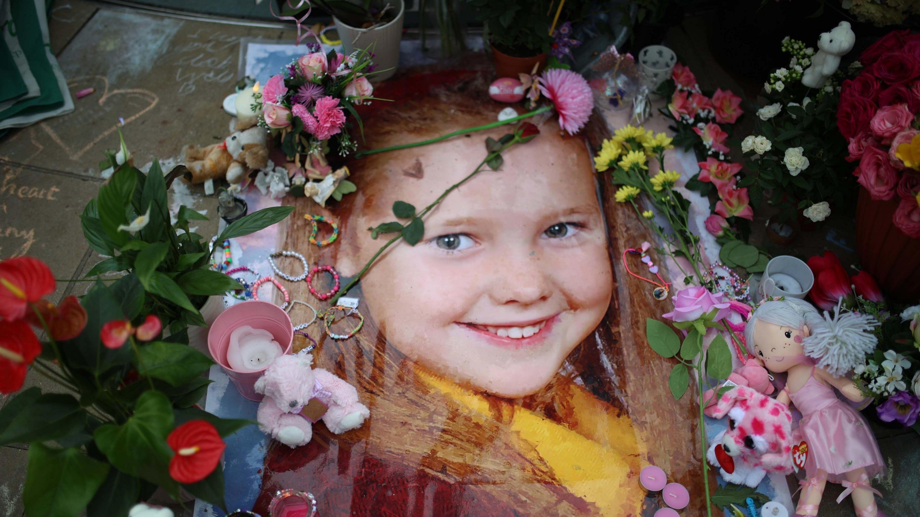 Floral tribute placed in a picture of Elsie Dot Stancombe, left outside the Town Hall in Southport