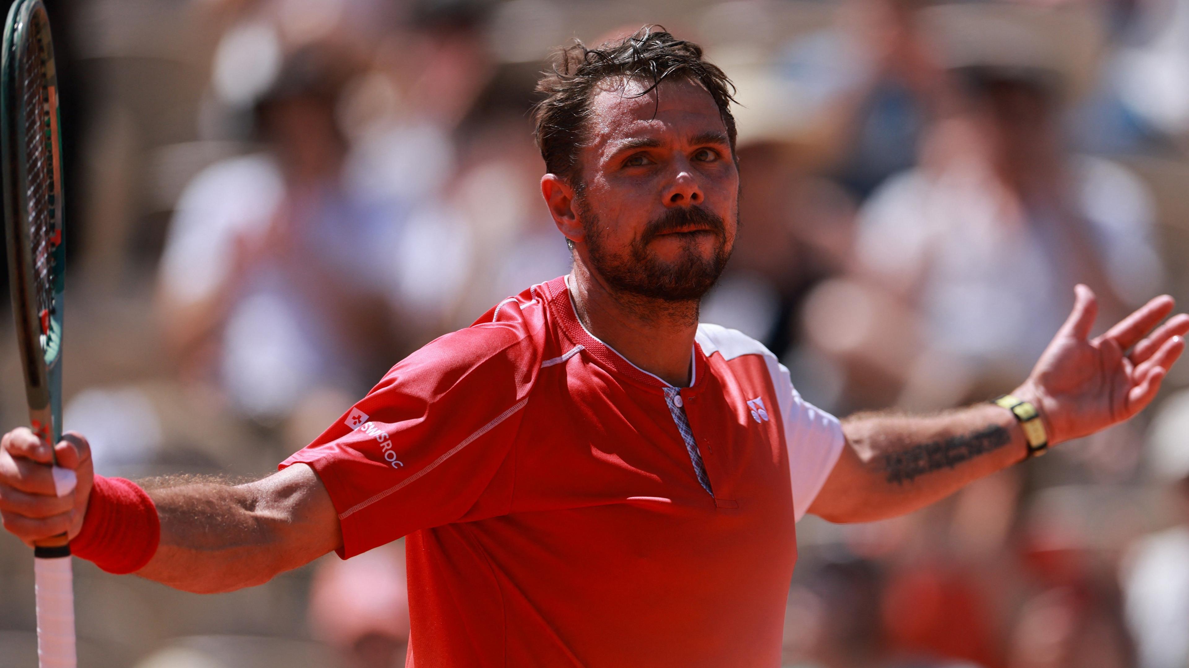 Stan Wawrinka celebrates a point during his final French Open match