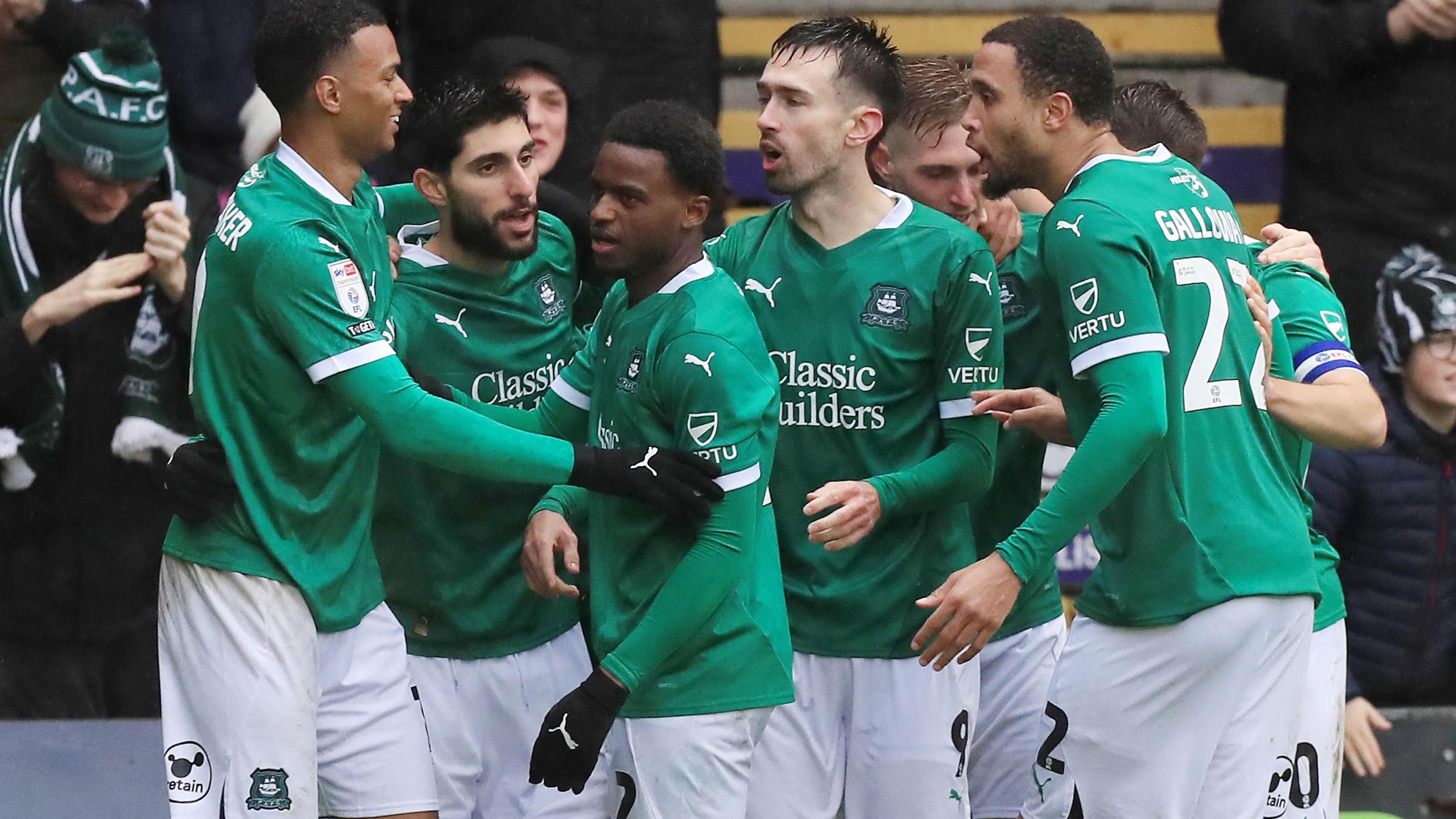 Plymouth Argyle's players celebrate at Home Park