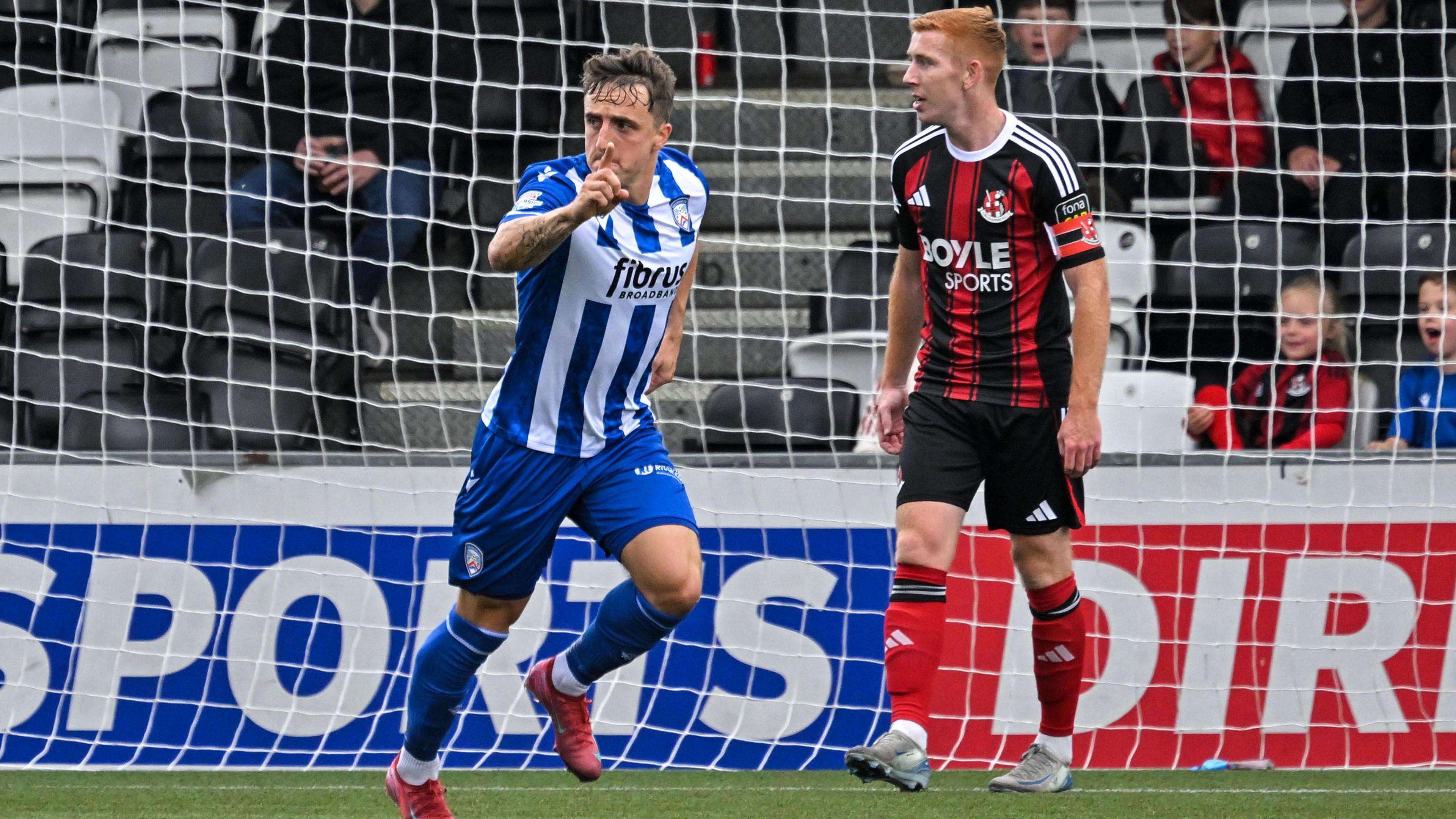 Joel Cooper celebrates arsenic Jarlath O'Rourke looks dejected