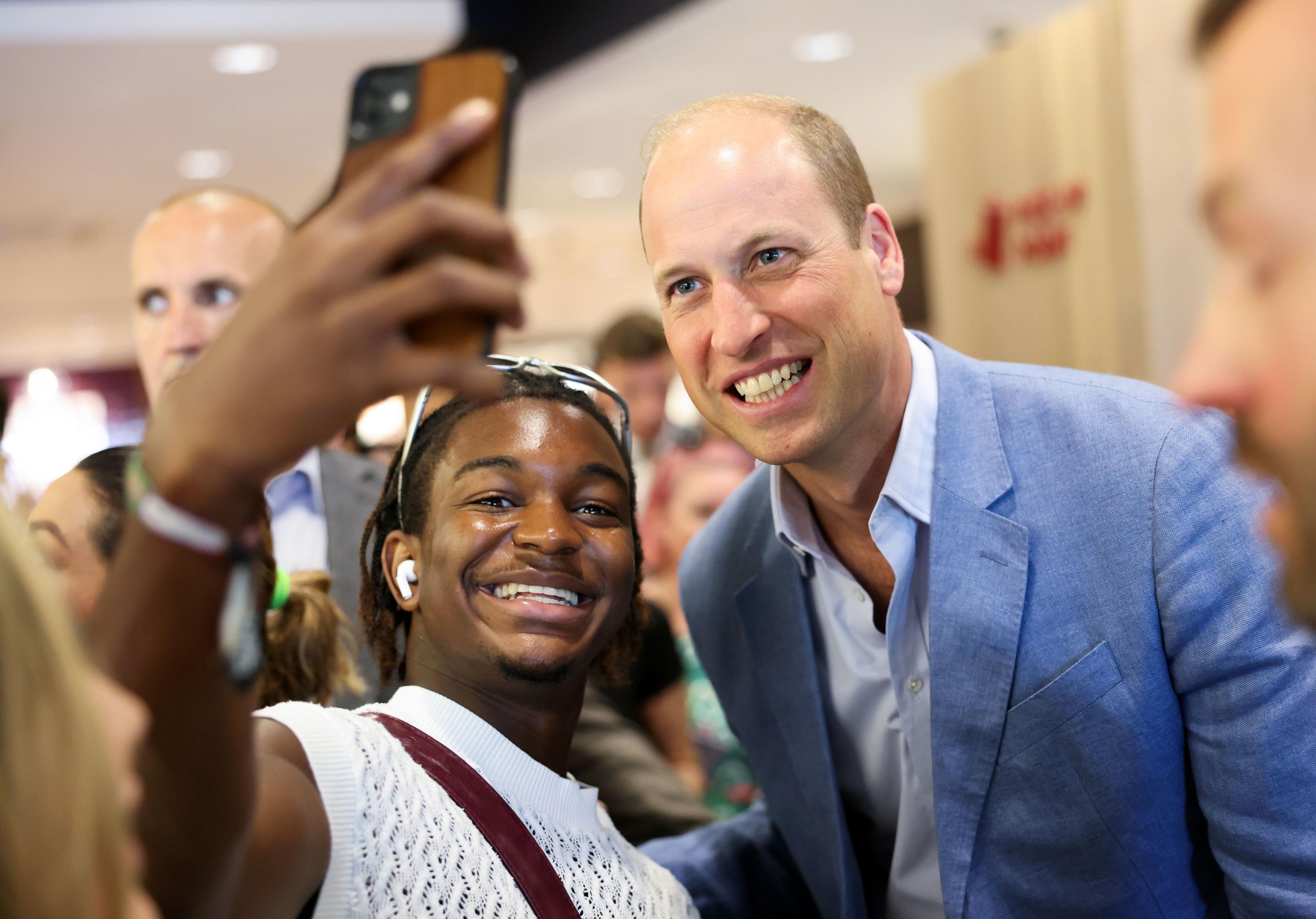 Prince William with a member of the public