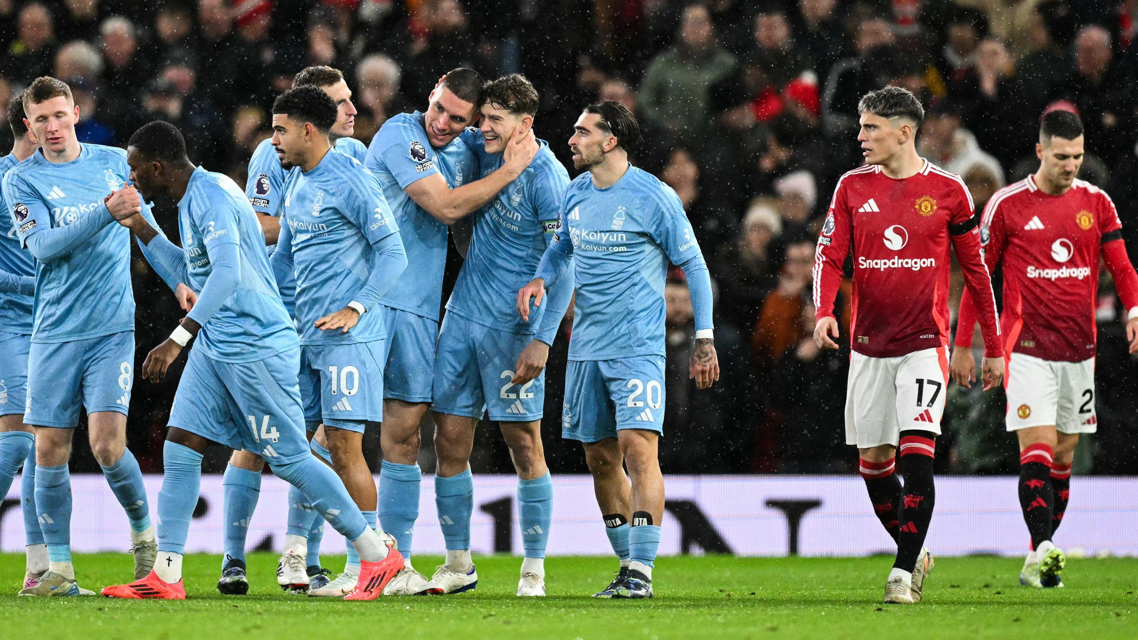 Nottingham Forest players celebrate as Nikola Milenkovic's goal at Manchester United. 