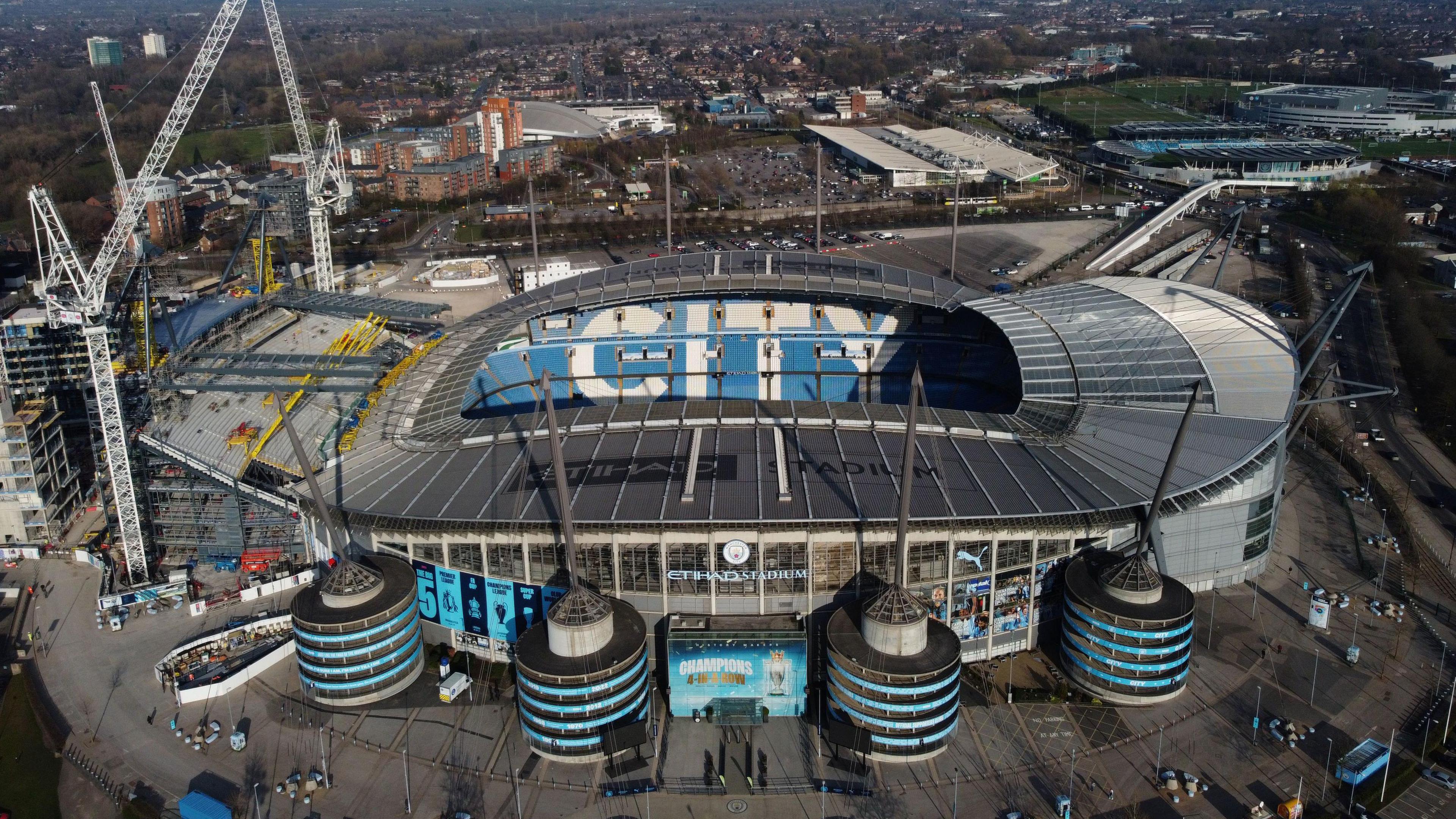 An aerial photo of the Etihad Stadium, a large football stadium in Manchester with blue Manchester City branding on
