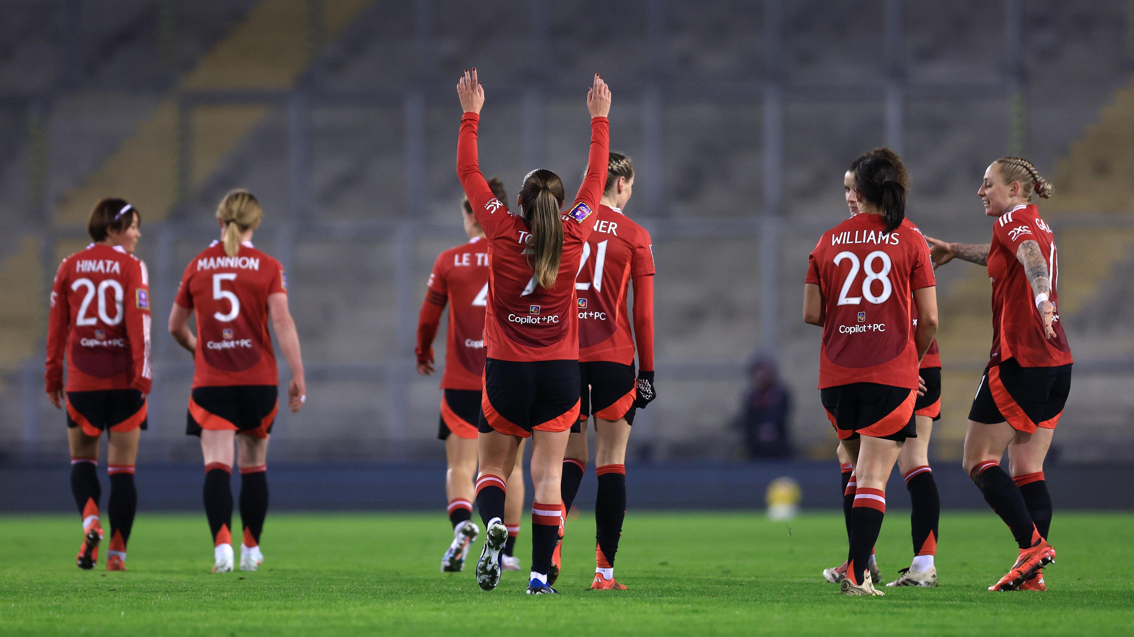 Ella Toone celebrates by pointing to the sky
