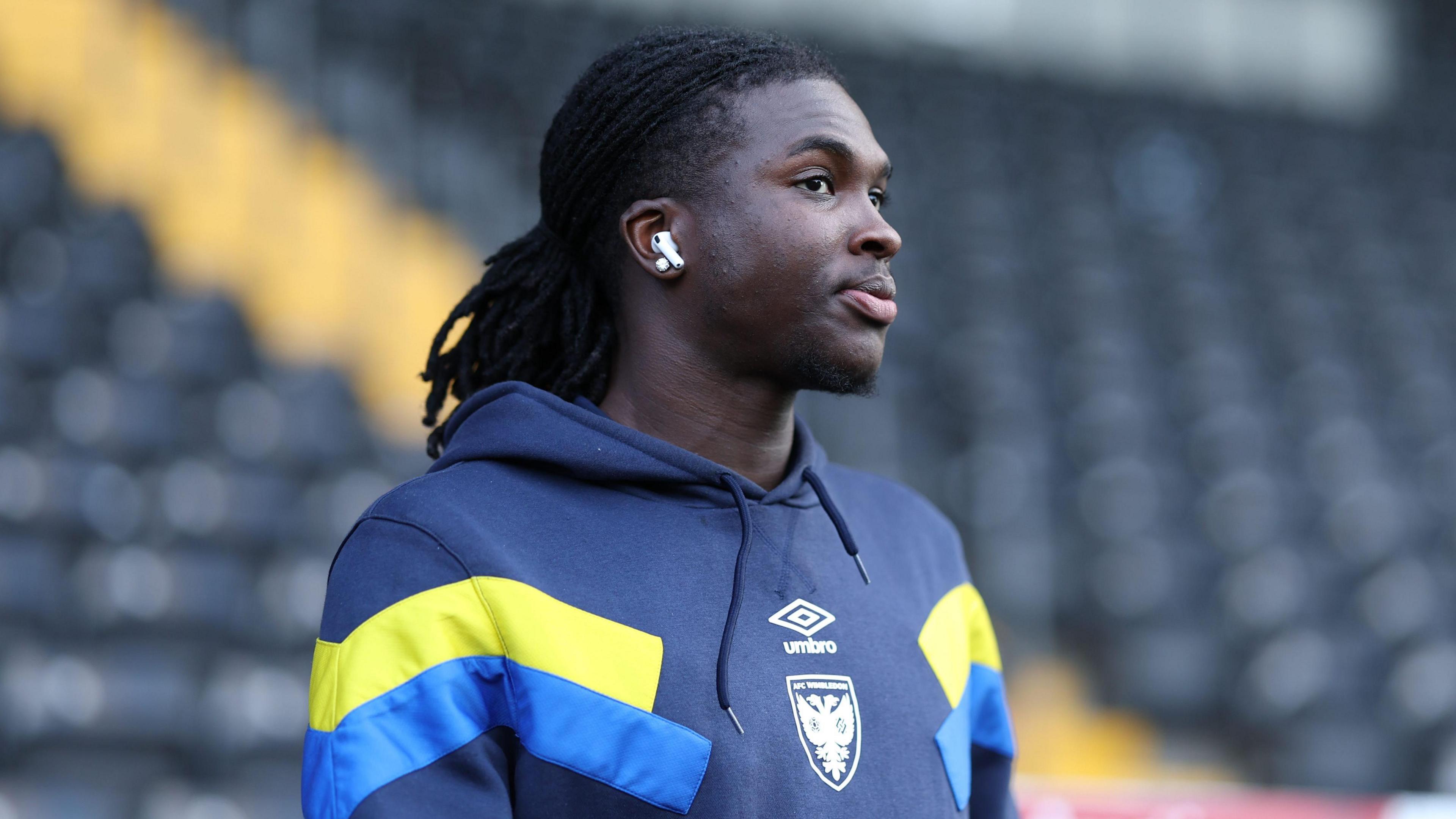 AFC Wimbledon player Osman Foyo looks on ahead of his game for the Dons 
