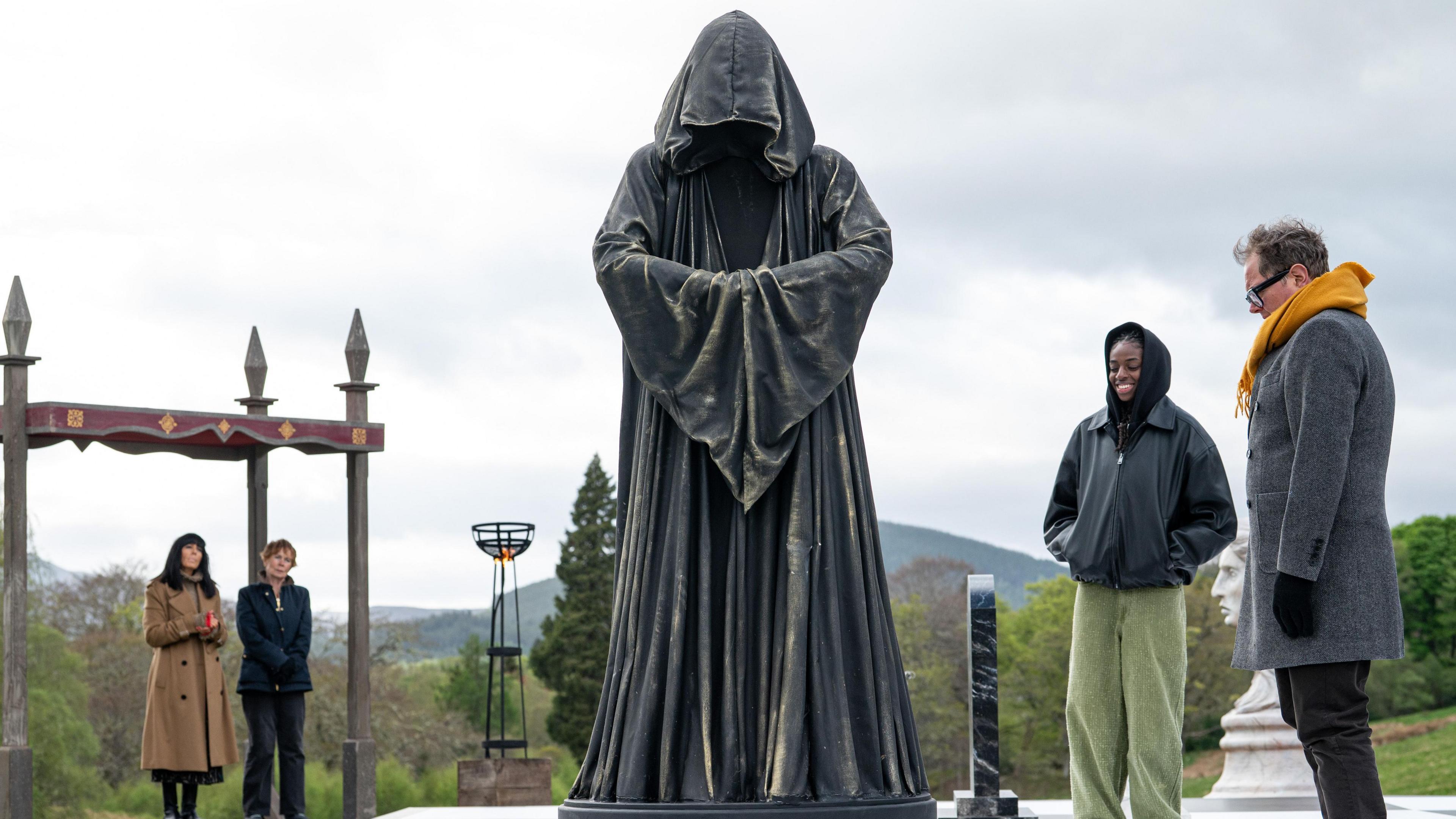 A giant traitor on a giant chessboard on The Traitors