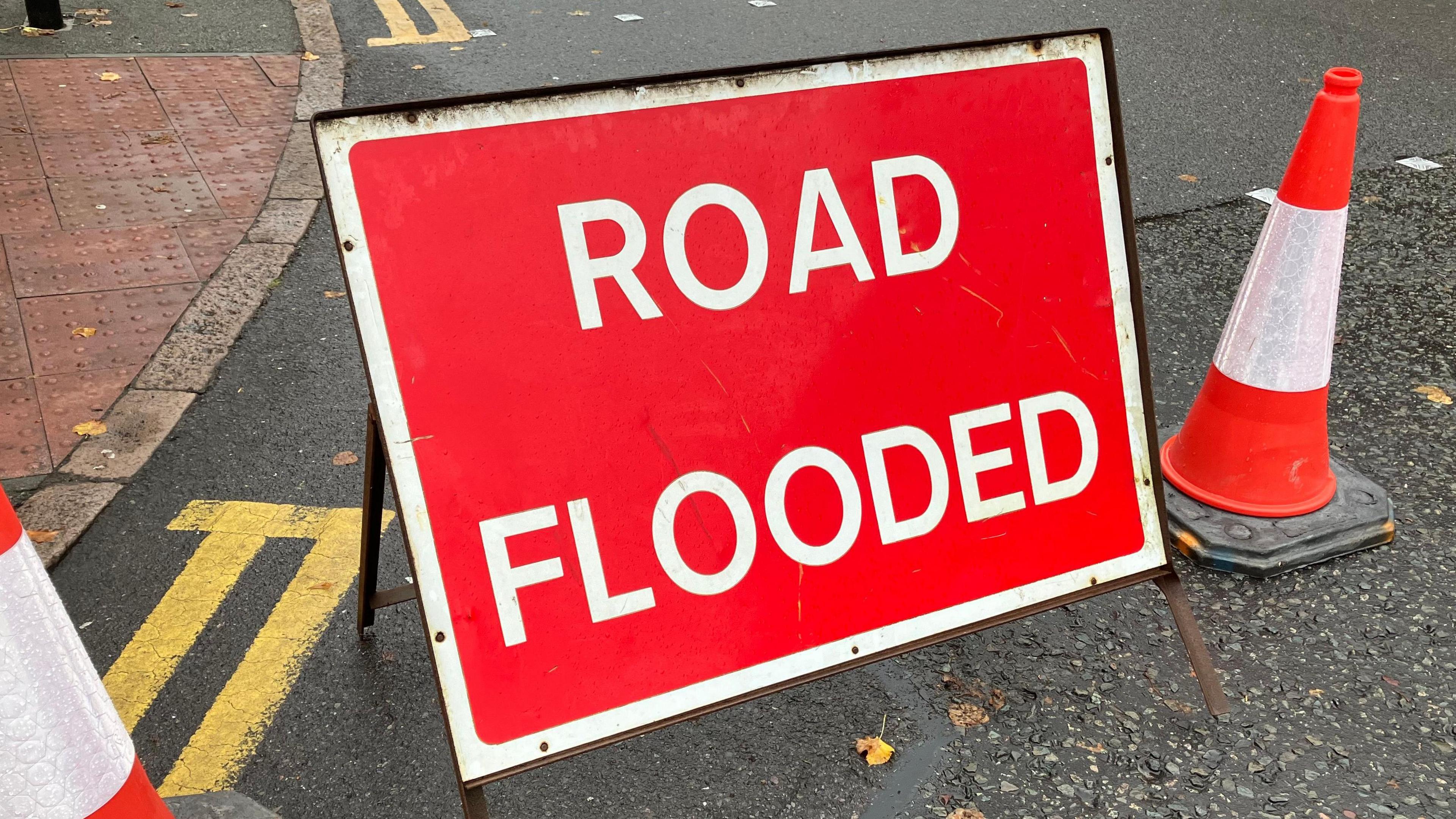 A road sign showing 'Road flooded' in Leicestershire - an increasingly common sight 