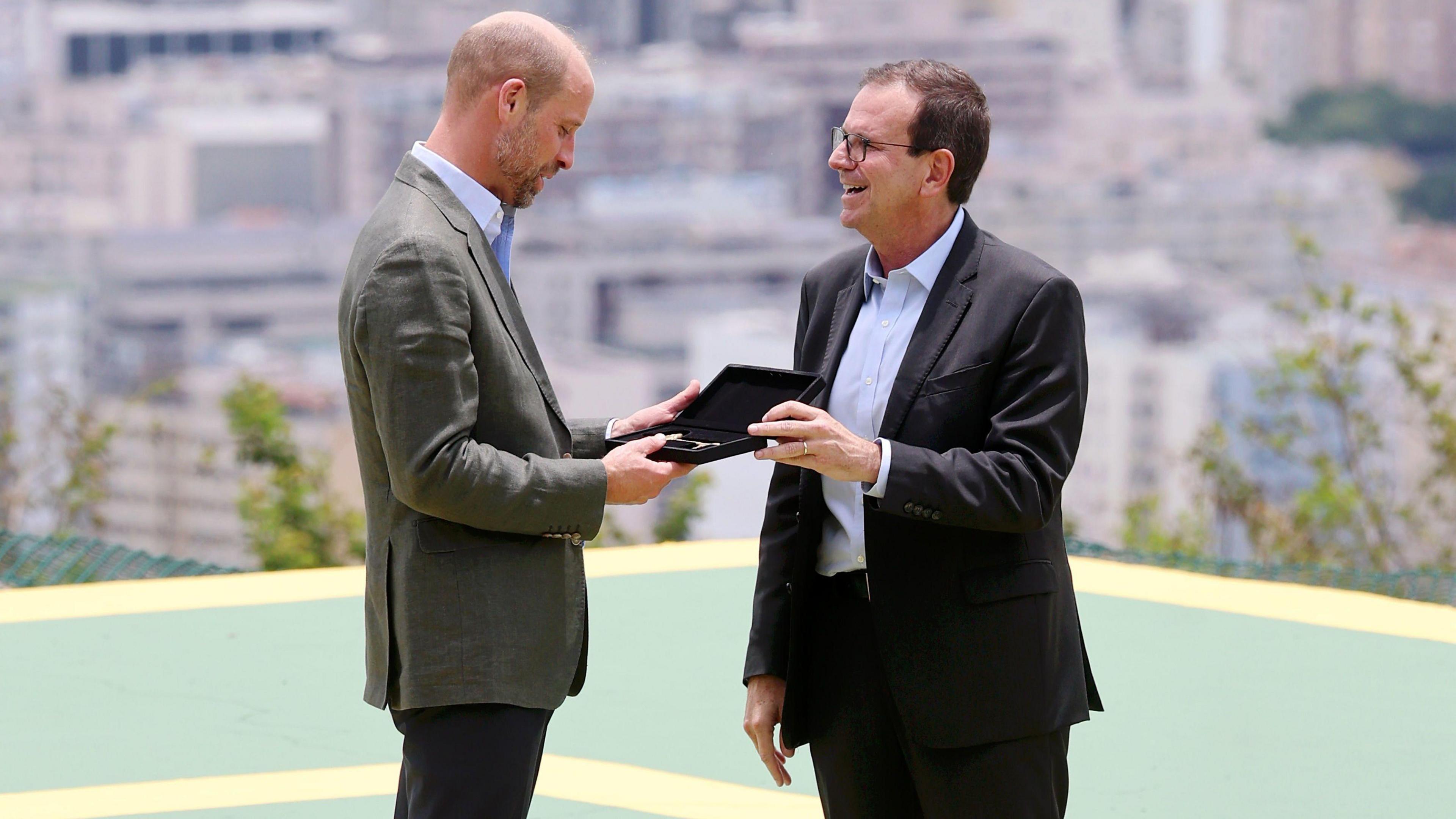 Prince William is presented with the keys to the city by the Mayor of Rio de Janeiro, Eduardo Paes, during a 'Welcome to Rio' event at Sugarloaf Mountain, in Rio de Janeiro,