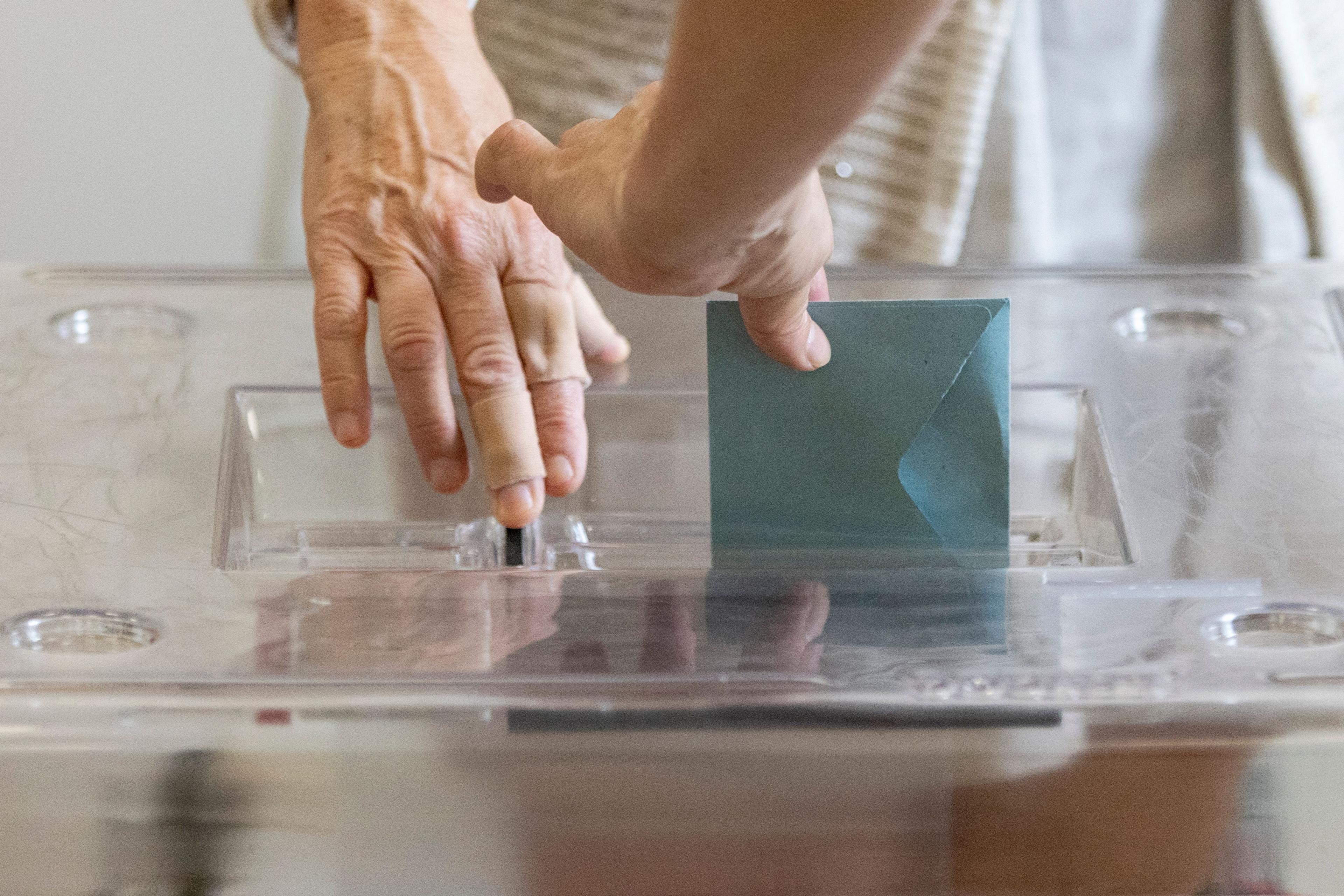 A voter casts his ballot during the second round of French parliamentary elect