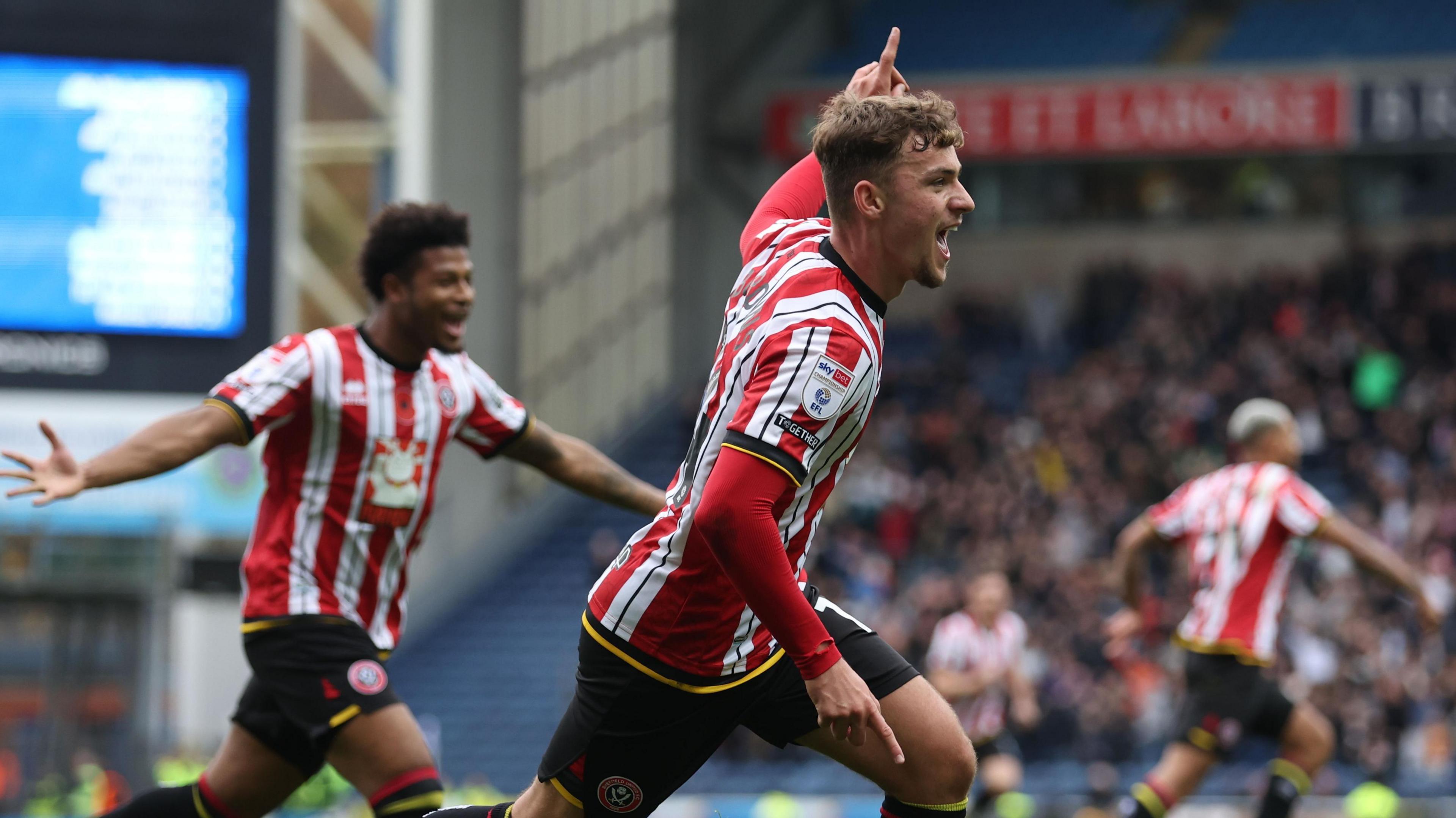 Harrison Burrows leads the celebrations after opening the scoring for Sheffield United against Blackburn Rovers at Ewood Park