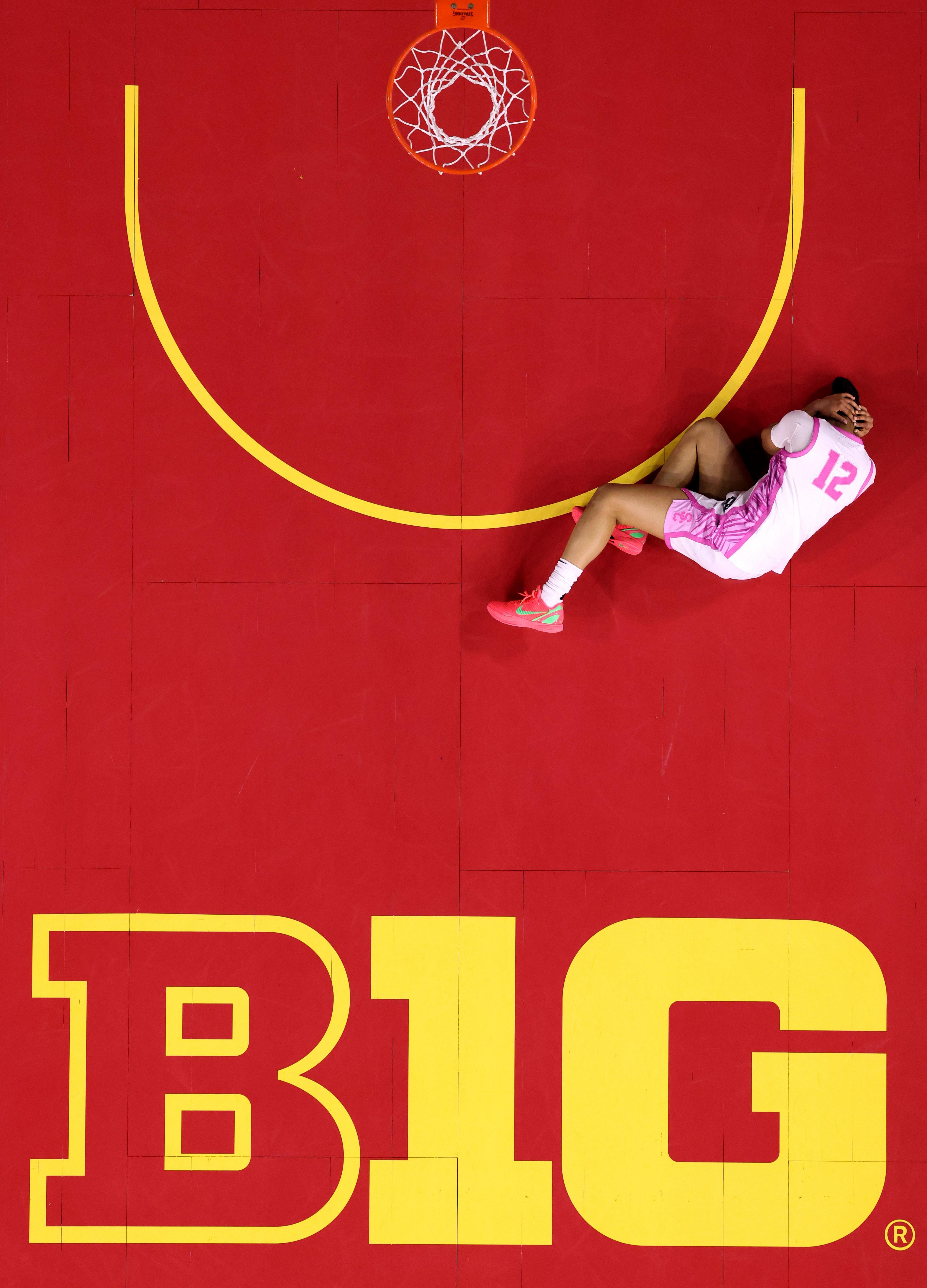 USC Trojans' JuJu Watkins holds her head after taking a knock during their victory over the Michigan State Spartans in Los Angeles