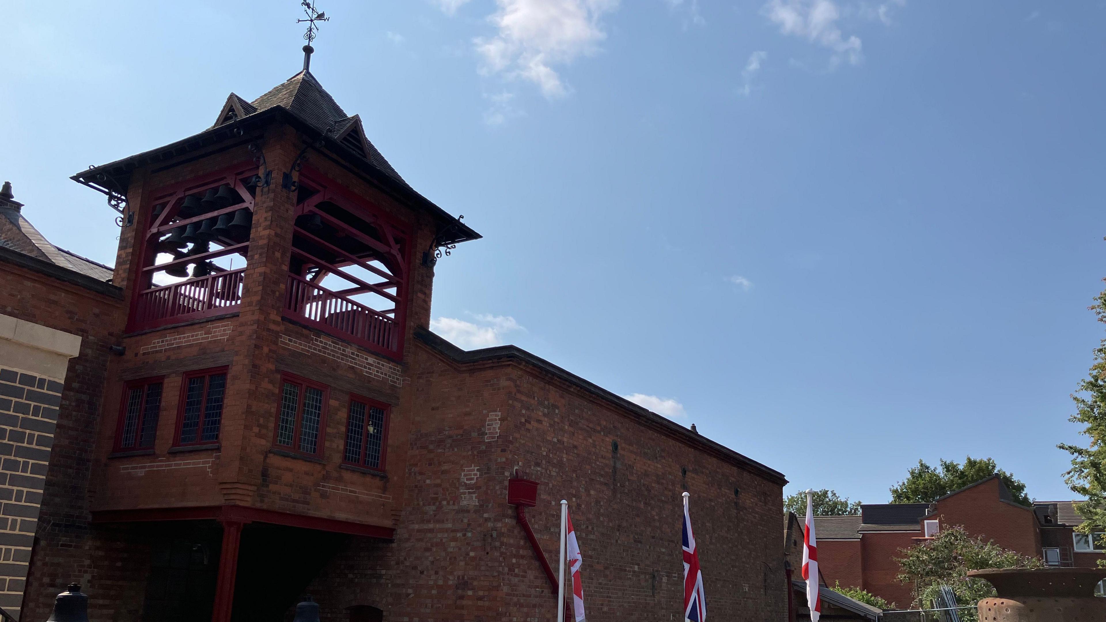 A bell tower on top of a foundry building