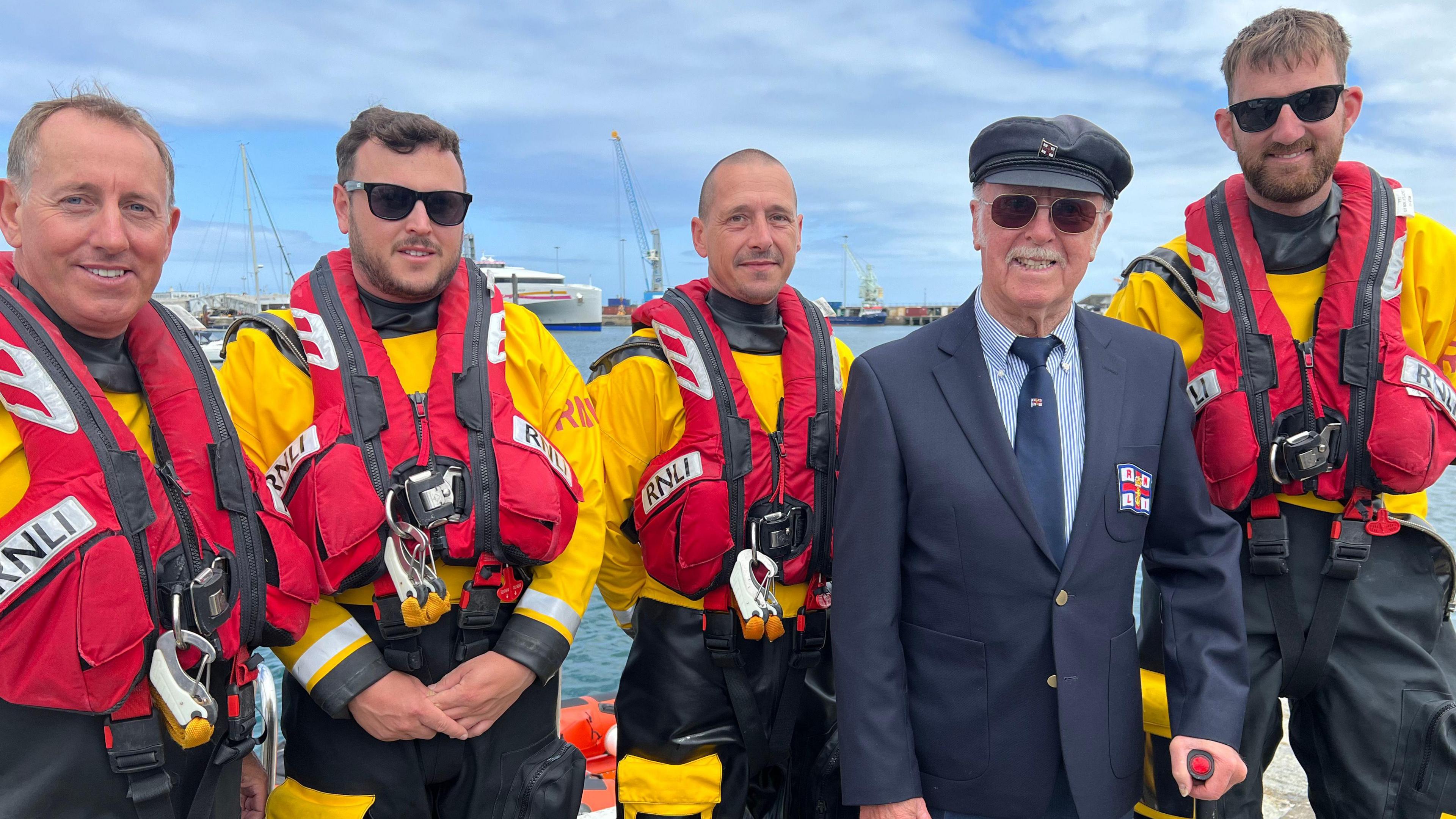 Tony Hobbs (second right) with St Peter Port RNLI crew members