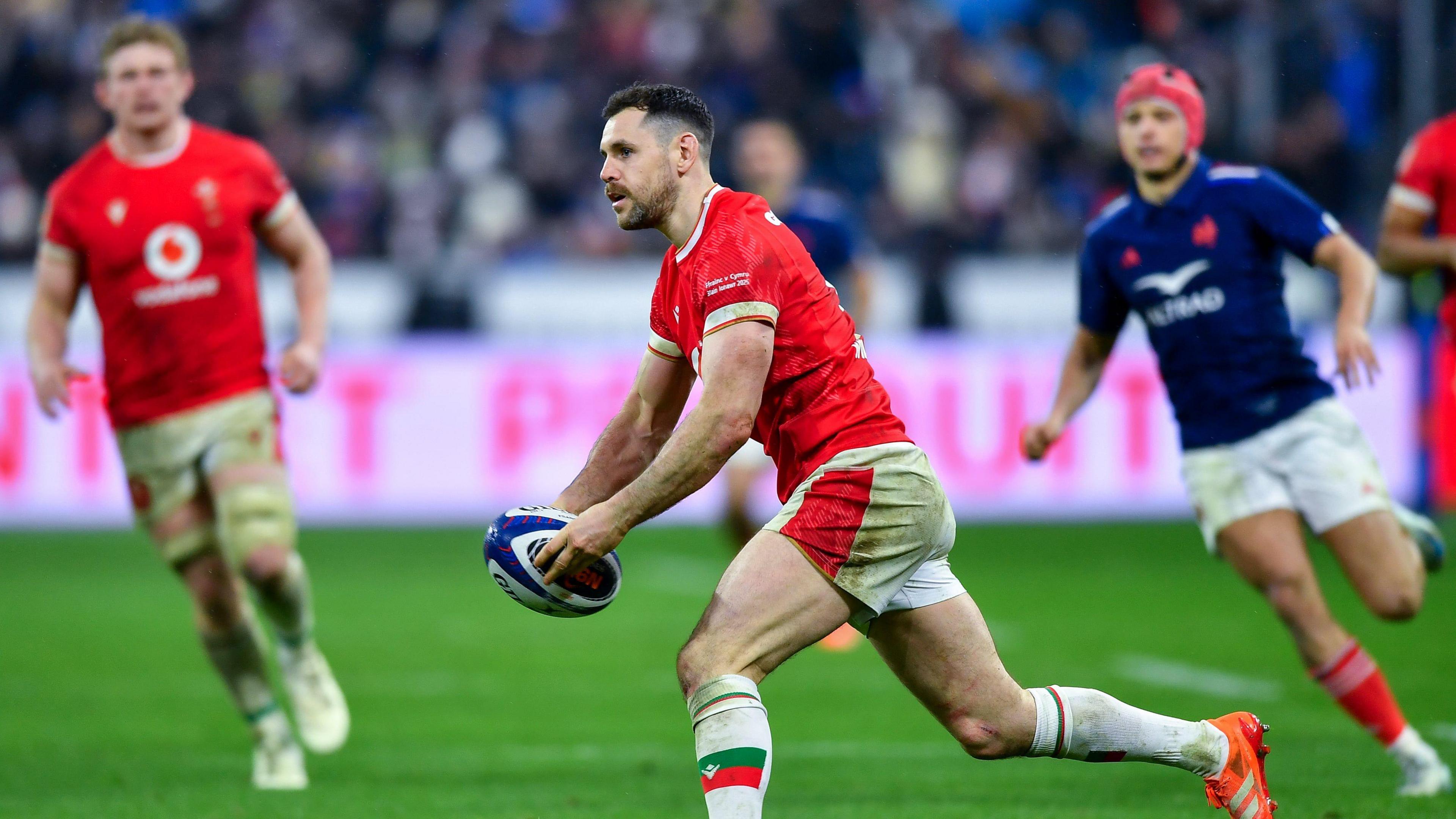 Tomos Williams of Wales passes the ball during the Guinness Six Nations 2025 match between France and Wales at Stade de France on January 31, 2025 in Paris, France. 