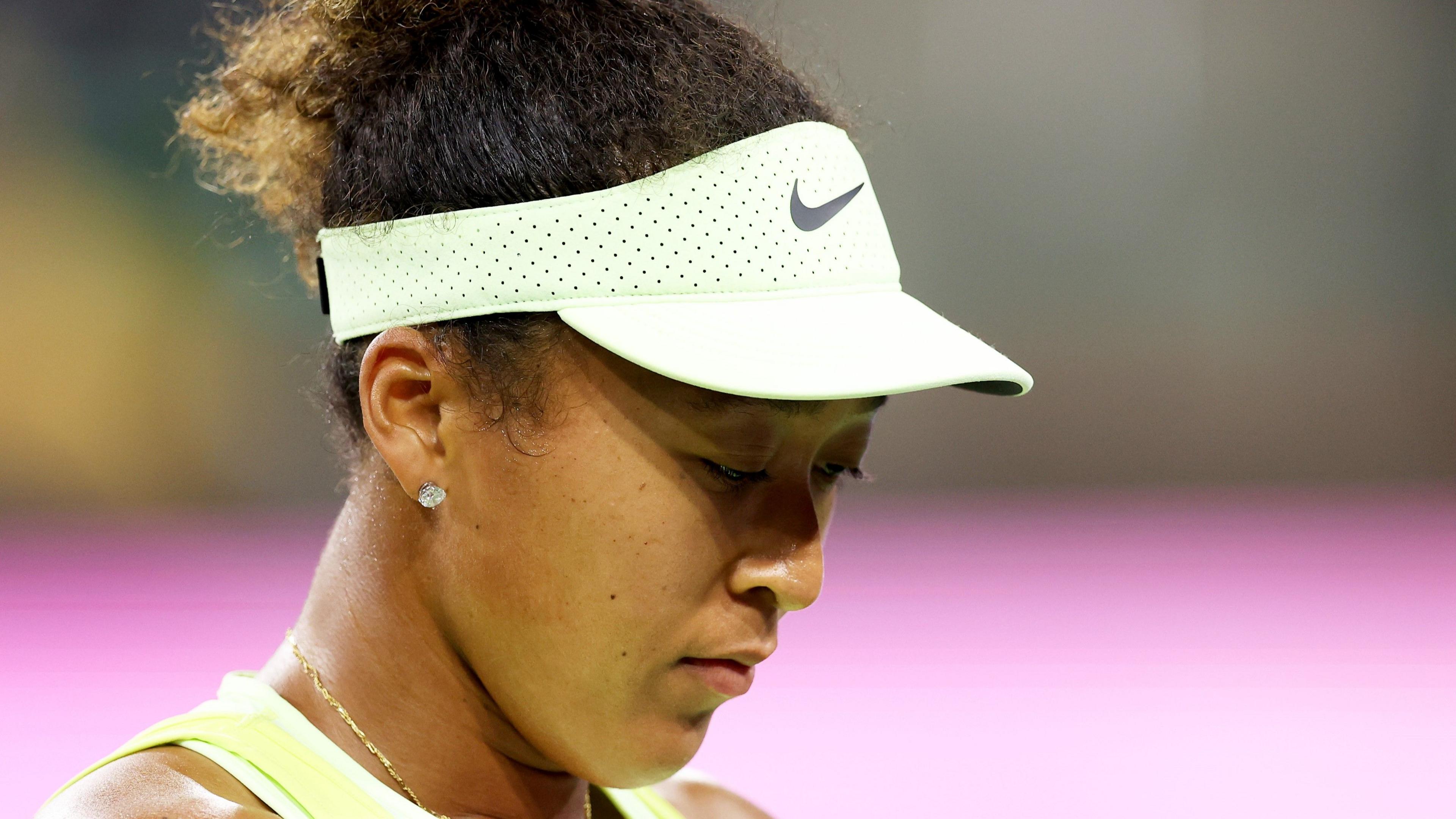 Naomi Osaka reacts during her Indian Wells first-round less