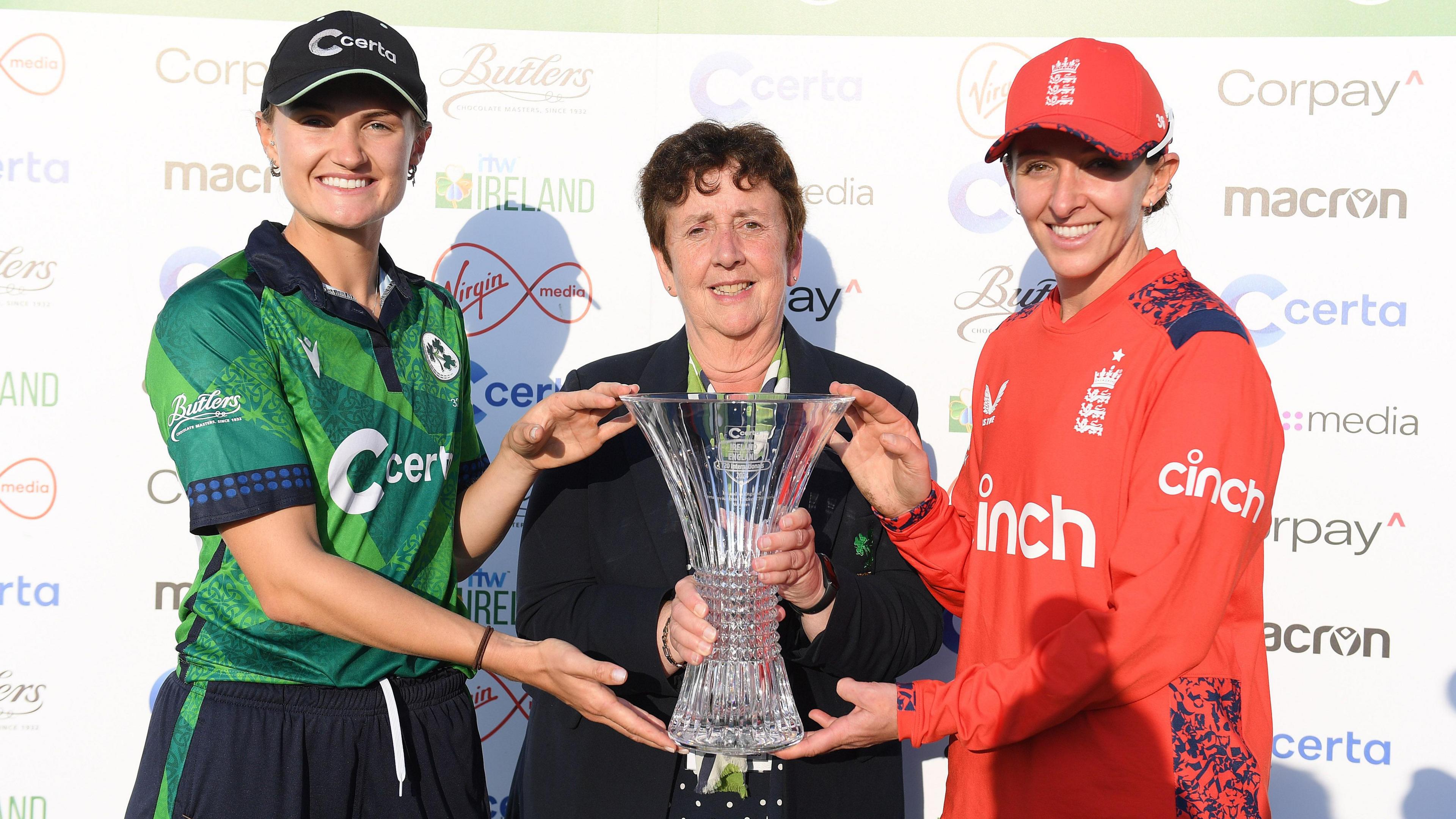 Ireland captain Gaby Lewis and England skipper Kate Cross with the T20 trophy after the series was tied