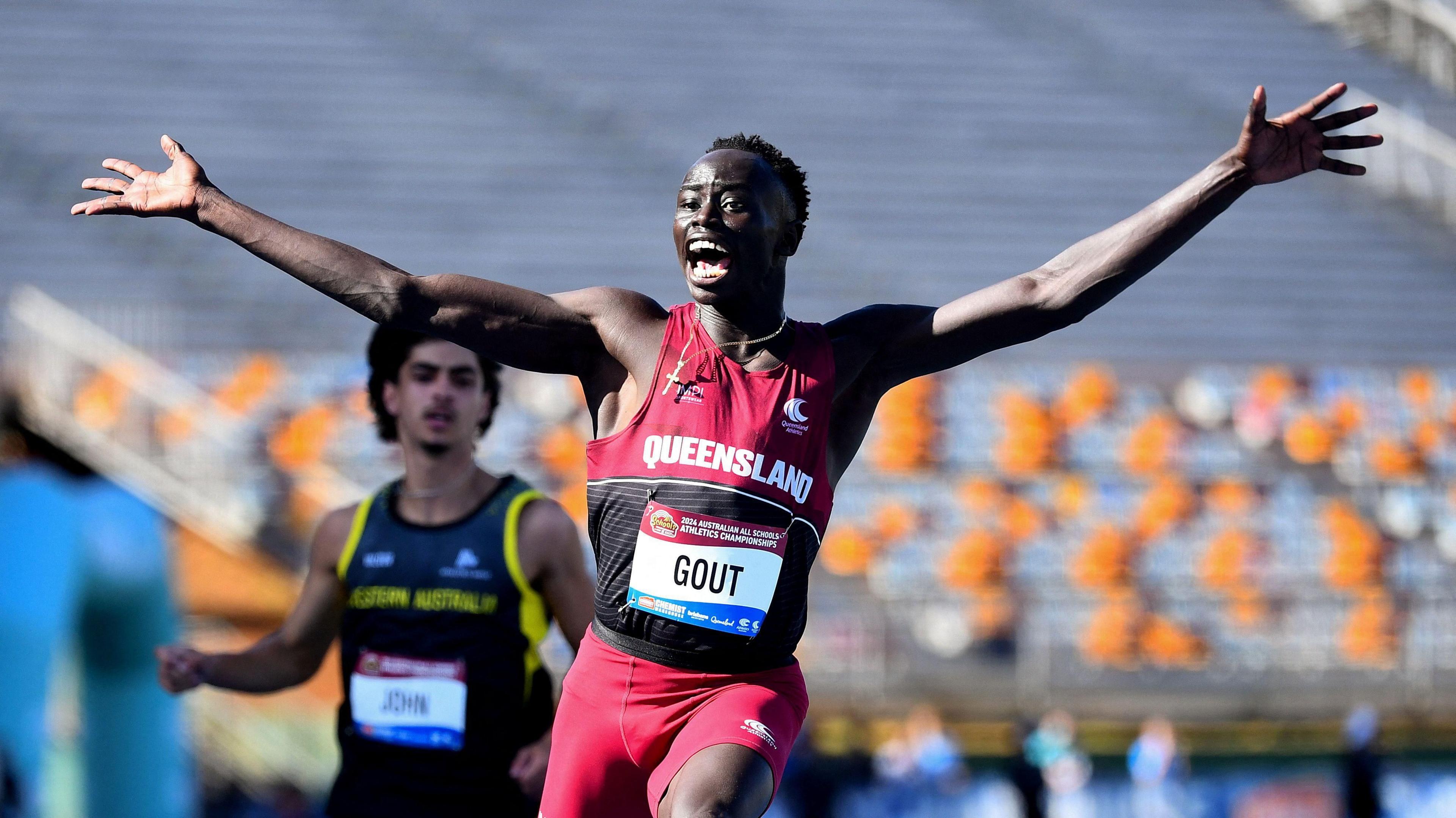 Gout Gout of Australia celebrates winning the U18s, 100m final