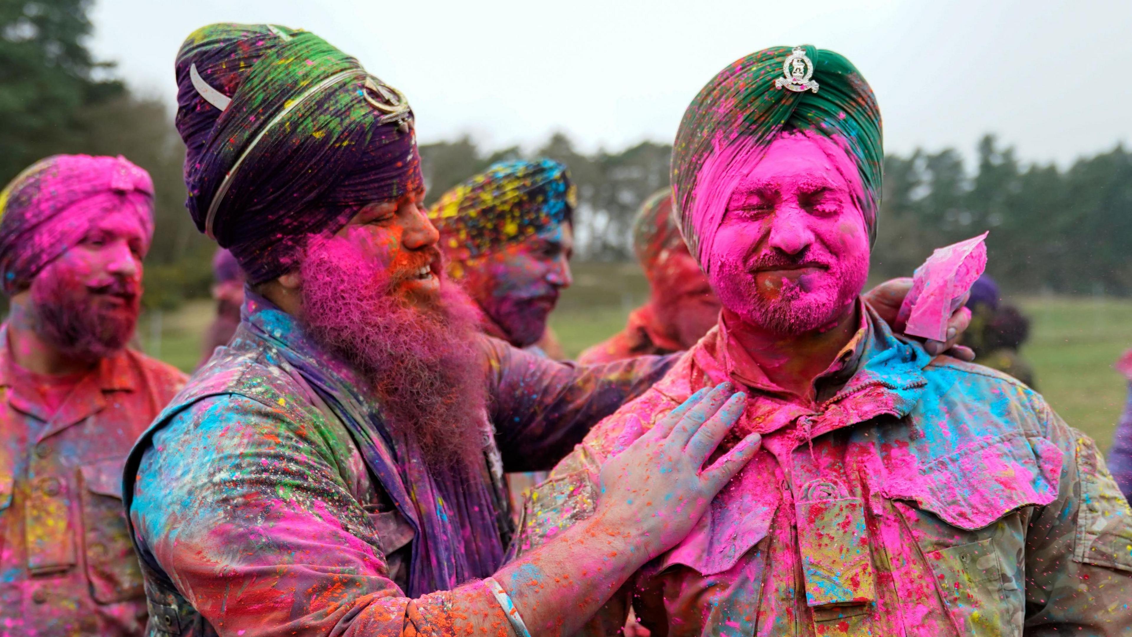 Sikh soldiers of the British Army have powdered paint thrown over them as they take part in the Holla Mahalla Sikh military festival, at the Aldershot Garrison, Hampshire.