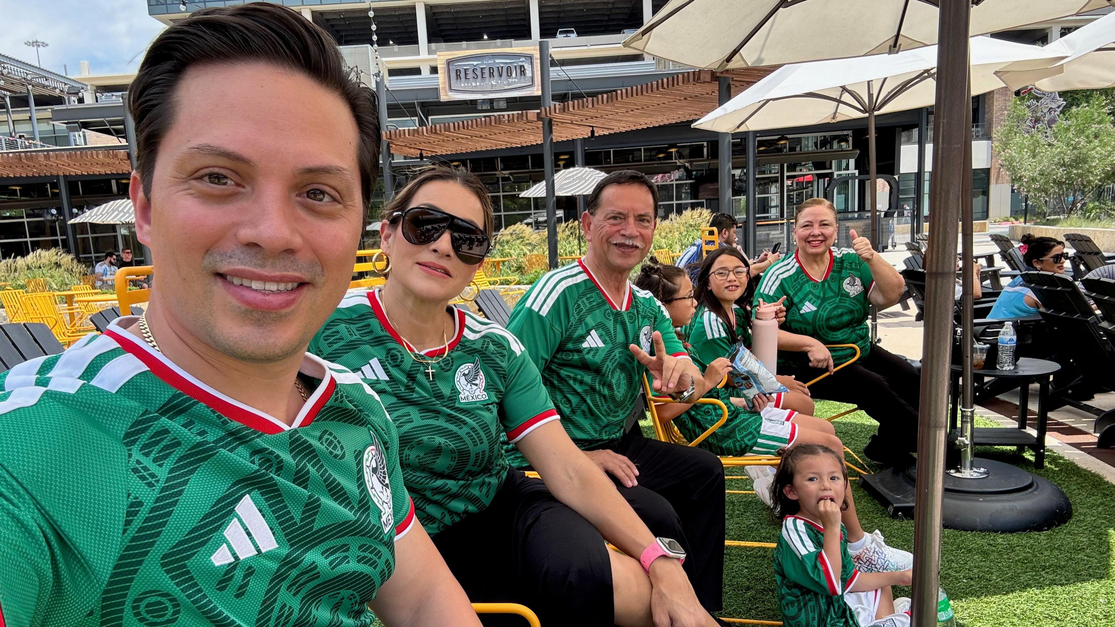 Sergio Enrique Alvarado Montalvo takes a selfie with his family as everyone sports a Mexico jersey.